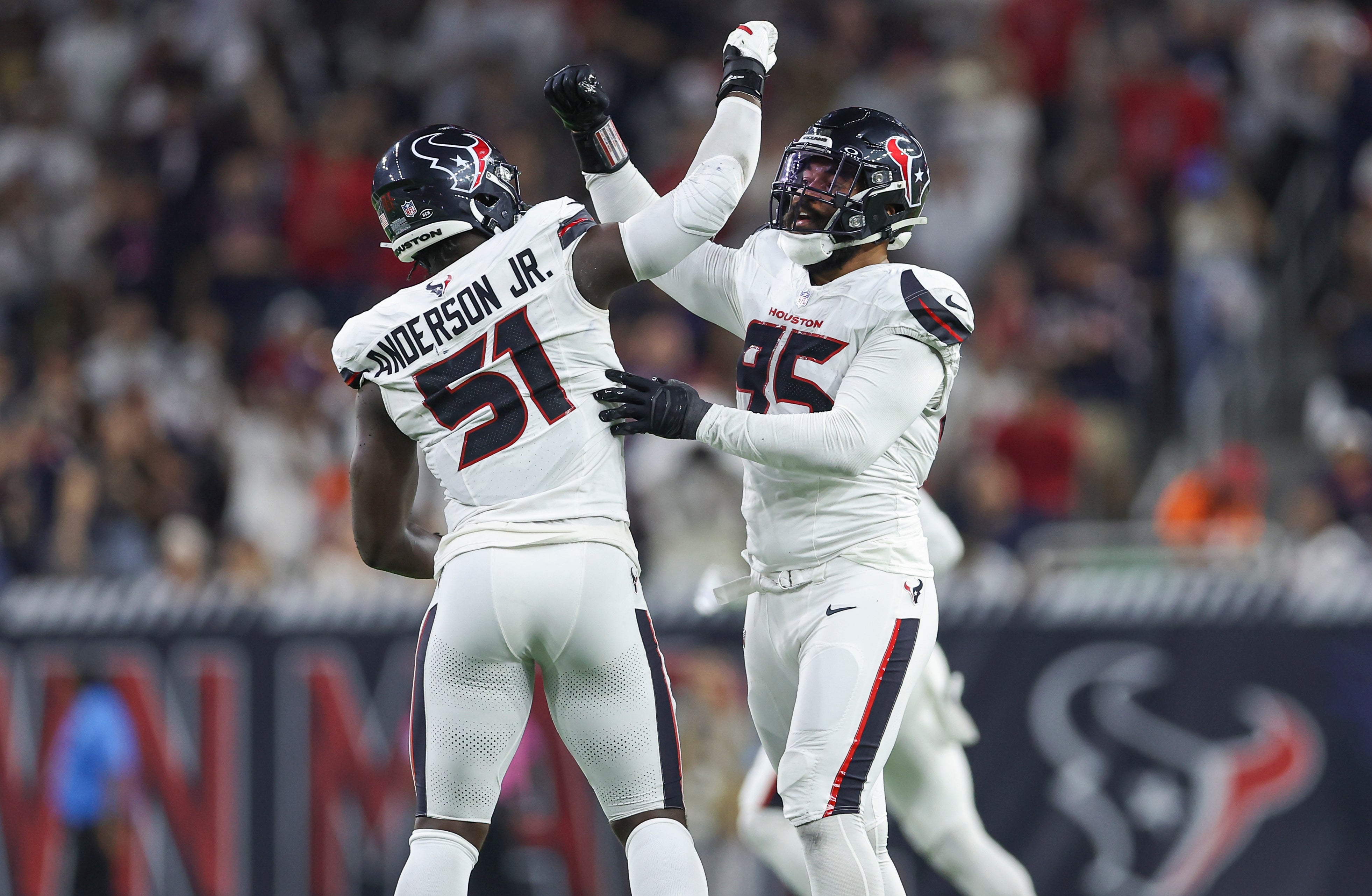 Sep 15, 2024; Houston, Texas, USA; Houston Texans defensive end Derek Barnett (95) celebrates with defensive end Will Anderson Jr. (51) after a sack during the second quarter against the Chicago Bears at NRG Stadium.