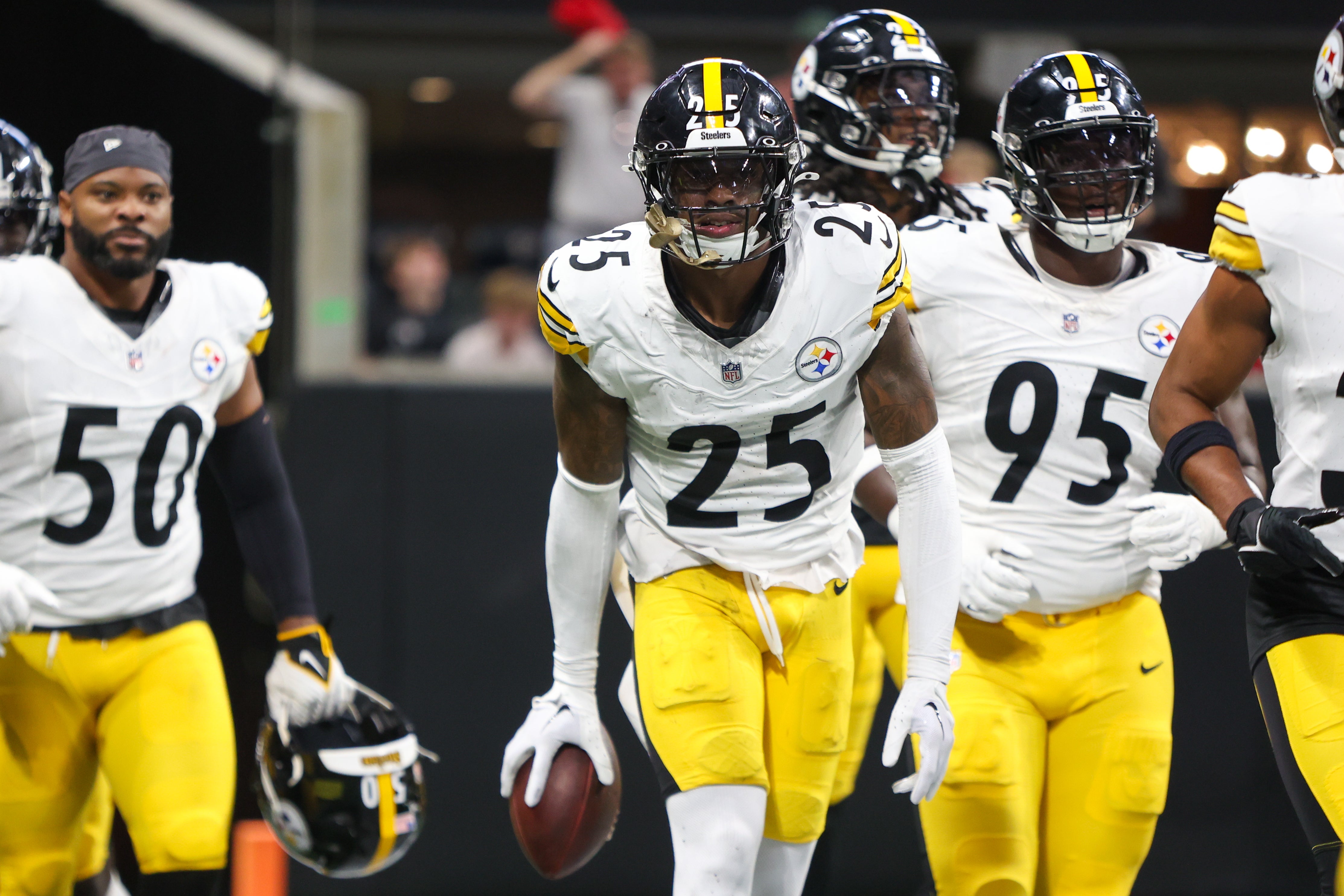 Sep 8, 2024; Atlanta, Georgia, USA; Pittsburgh Steelers safety DeShon Elliott (25) celebrates with teammates after an interception against the Atlanta Falcons in the first quarter at Mercedes-Benz Stadium.