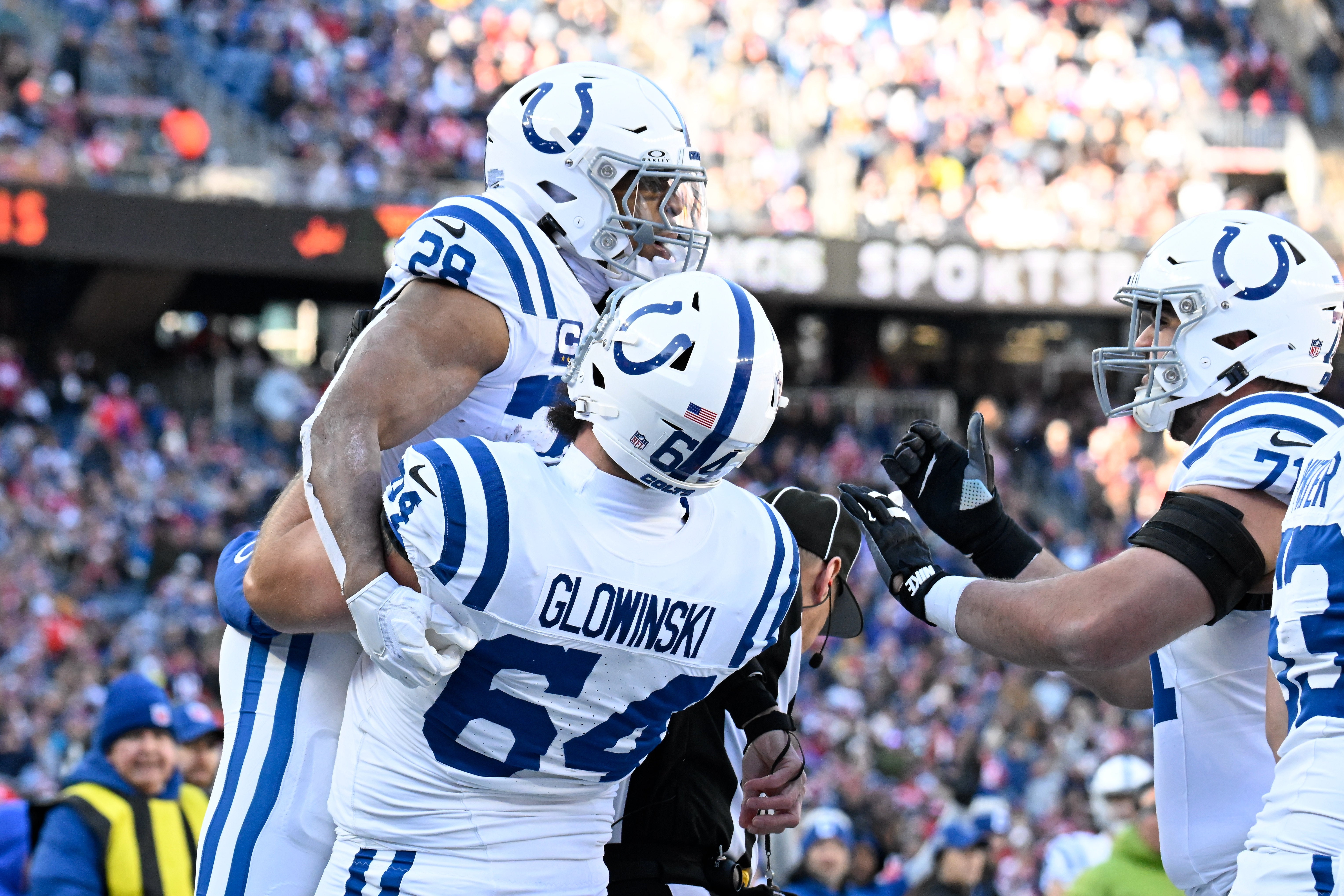 Dec 1, 2024; Foxborough, Massachusetts, USA; Indianapolis Colts running back Jonathan Taylor (28) celebrates a touchdown during the first half against the New England Patriots at Gillette Stadium.