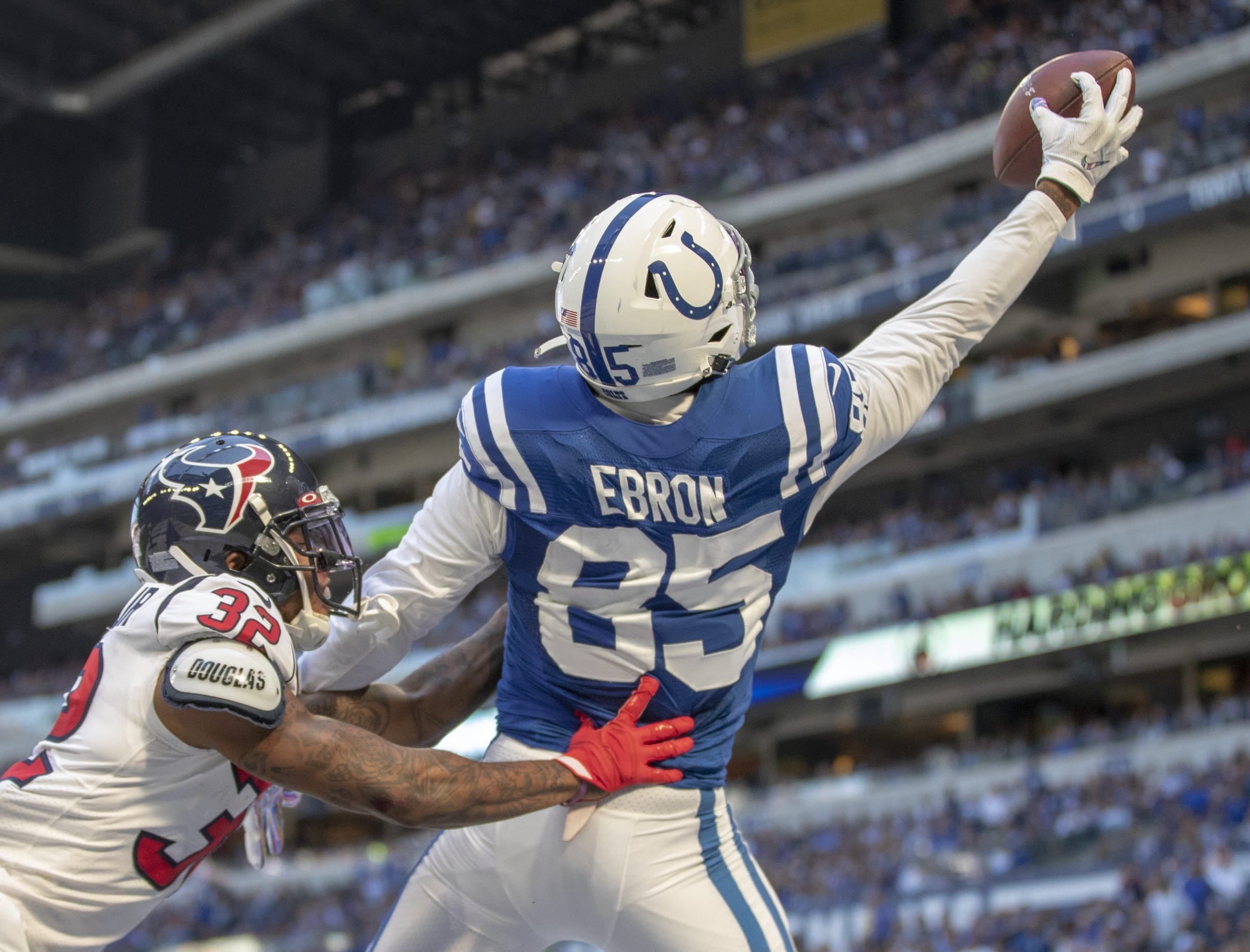 Eric Ebron of the Indianapolis Colts grabs a one-handed touchdown as he is defended by Lonnie Johnson of the Houston Texans in Indianapolis on Oct. 20, 2019, at Lucas Oil Stadium. Houston Faces Colts For Afc South Supremacy