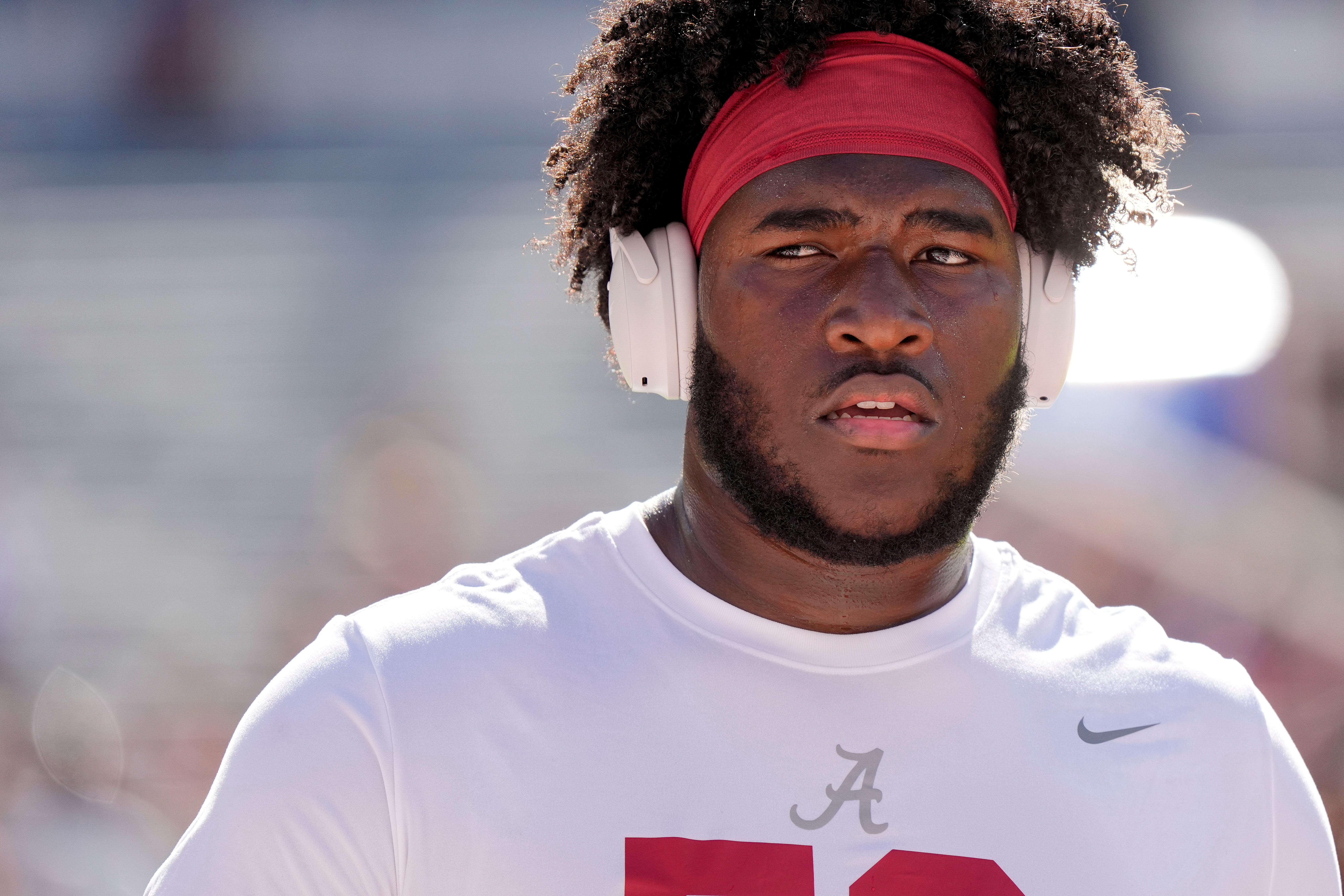 Nov 16, 2024; Tuscaloosa, AL, USA; Alabama Crimson Tide offensive lineman Tyler Booker (52) warms up before the game with the Mercer Bears at Bryant-Denny Stadium.