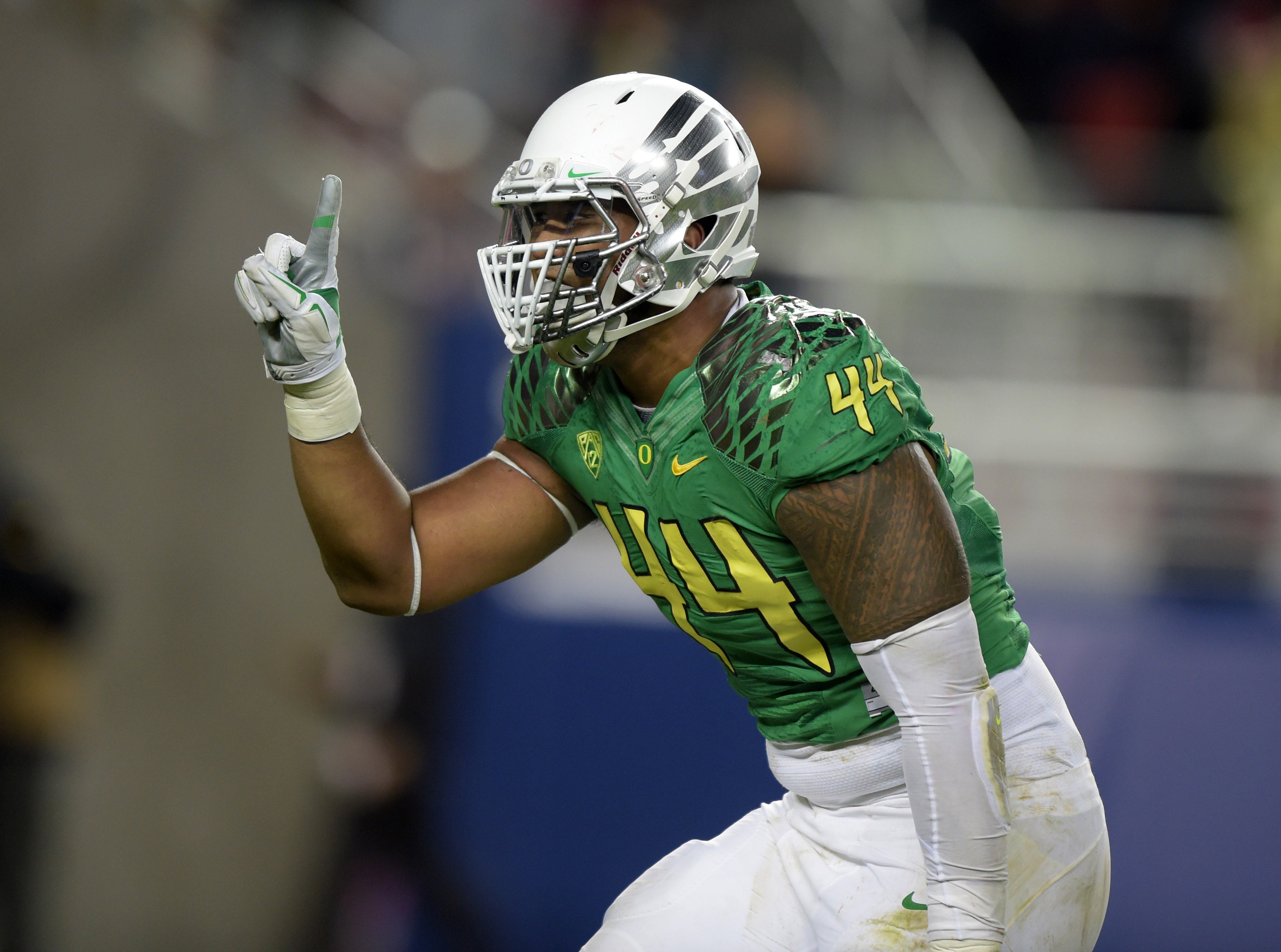 Dec 5, 2014; Santa Clara, CA, USA; Oregon Ducks defensive end DeForest Buckner (44) celebrates after a sack in the second quarter against the Arizona Wildcats in the Pac-12 Championship at Levi's Stadium.