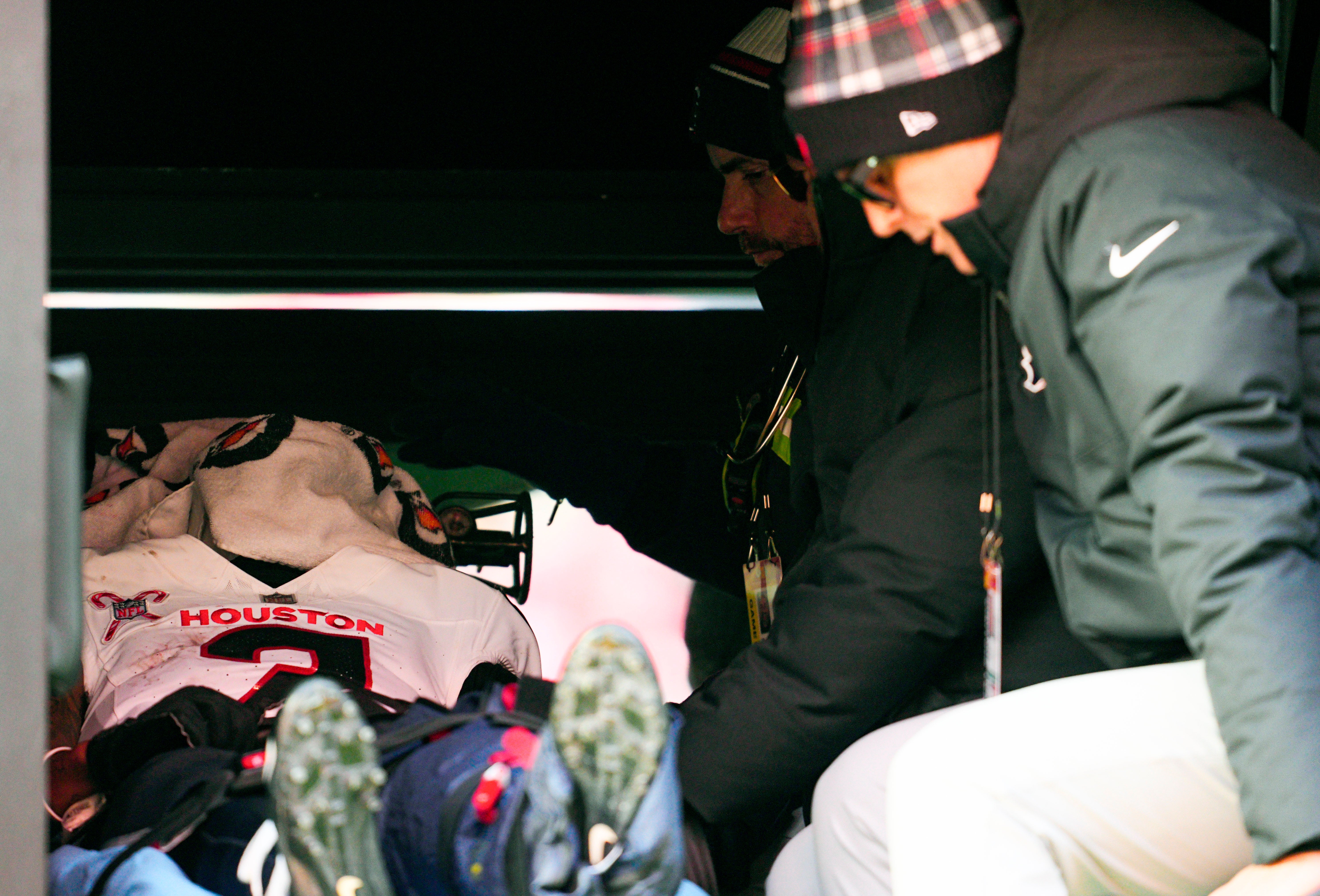 Dec 21, 2024; Kansas City, Missouri, USA; Houston Texans wide receiver Tank Dell (3) is carted off the field after an injury during the second half against the Houston Texans at GEHA Field at Arrowhead Stadium.