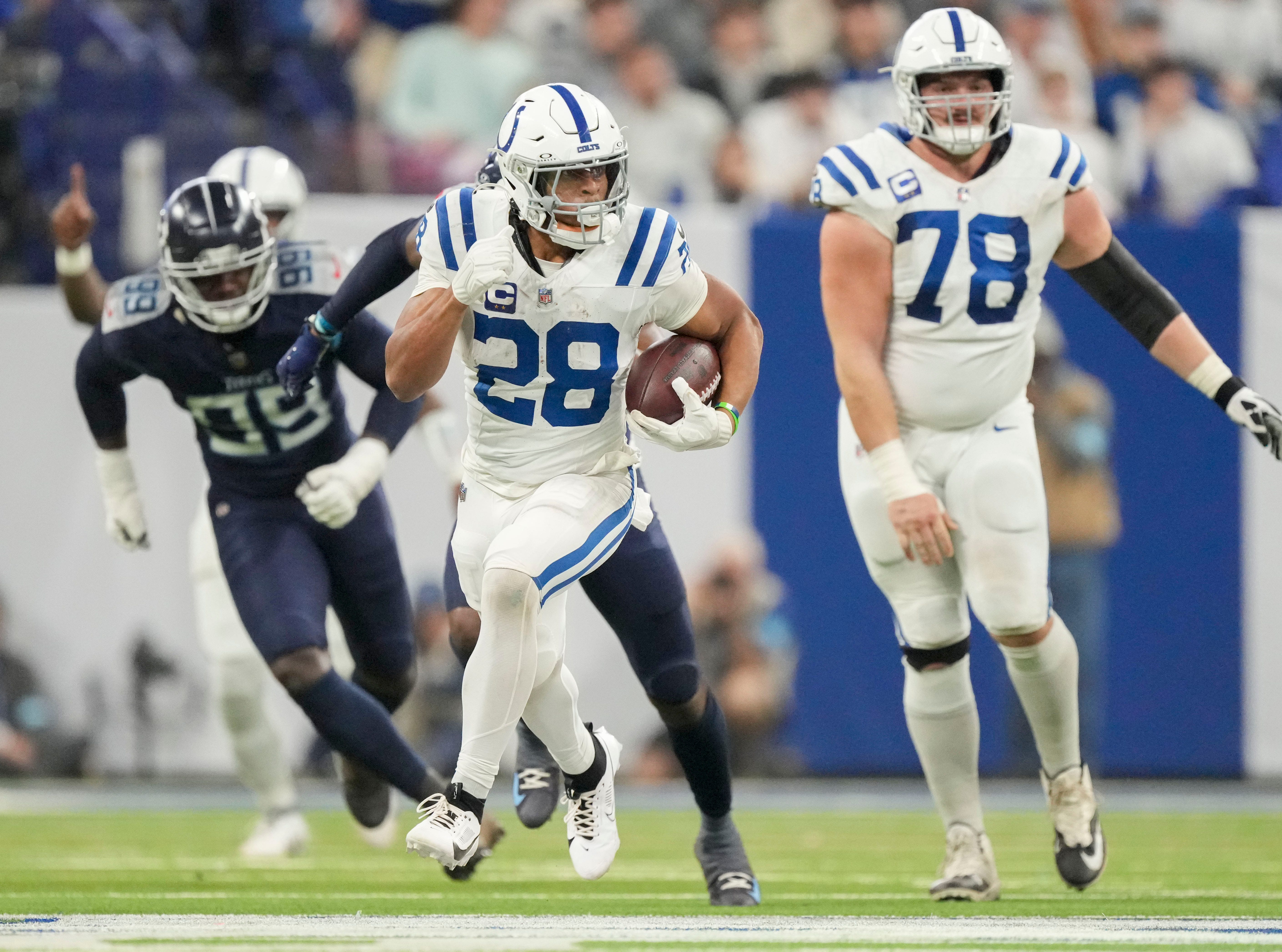 Indianapolis Colts running back Jonathan Taylor (28) rushes for a touchdown Sunday, Dec. 22, 2024, during a game against the Tennessee Titans at Lucas Oil Stadium in Indianapolis.