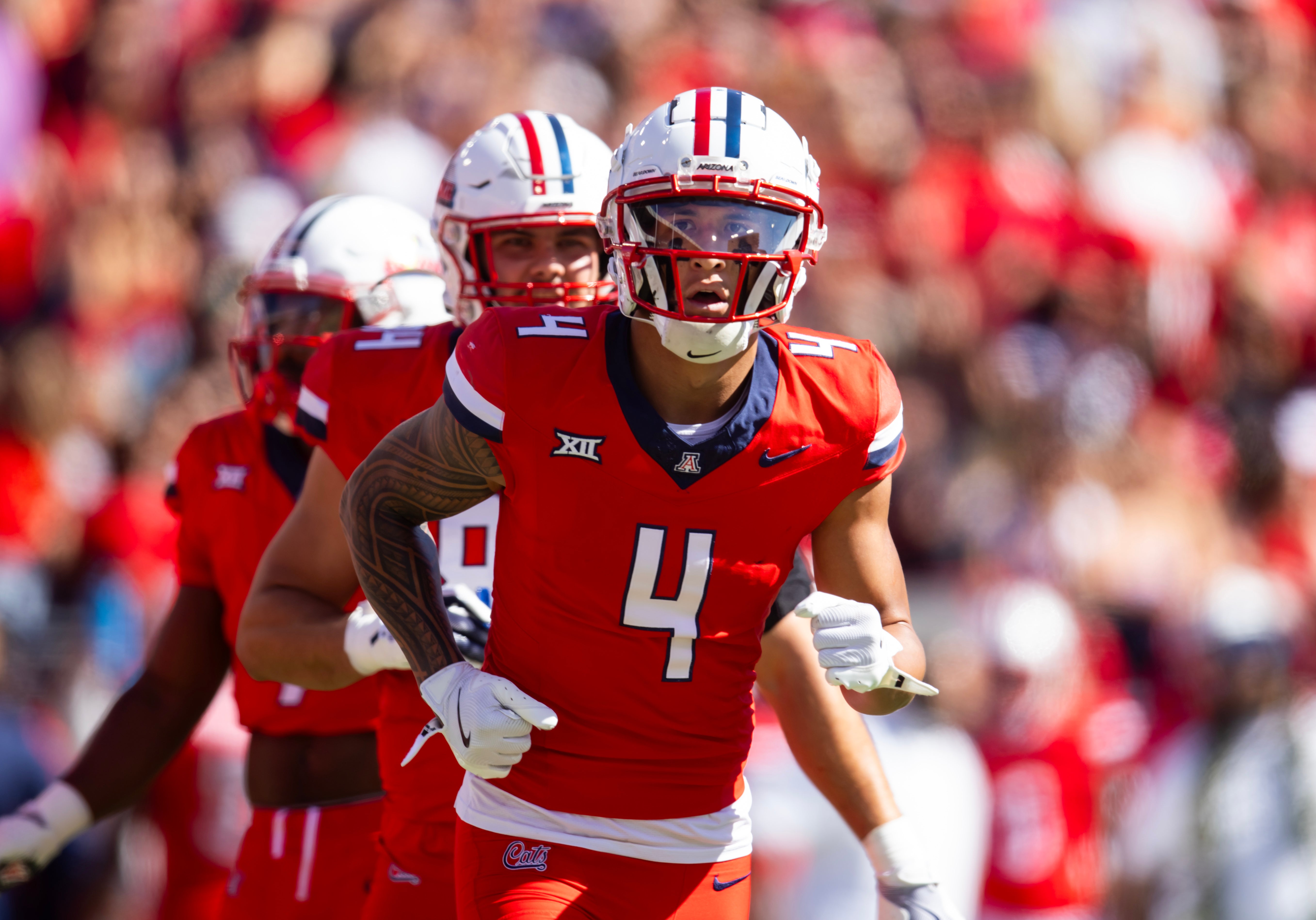 Oct 19, 2024; Tucson, Arizona, USA; Arizona Wildcats wide receiver Tetairoa McMillan (4) against the Colorado Buffalos at Arizona Stadium.