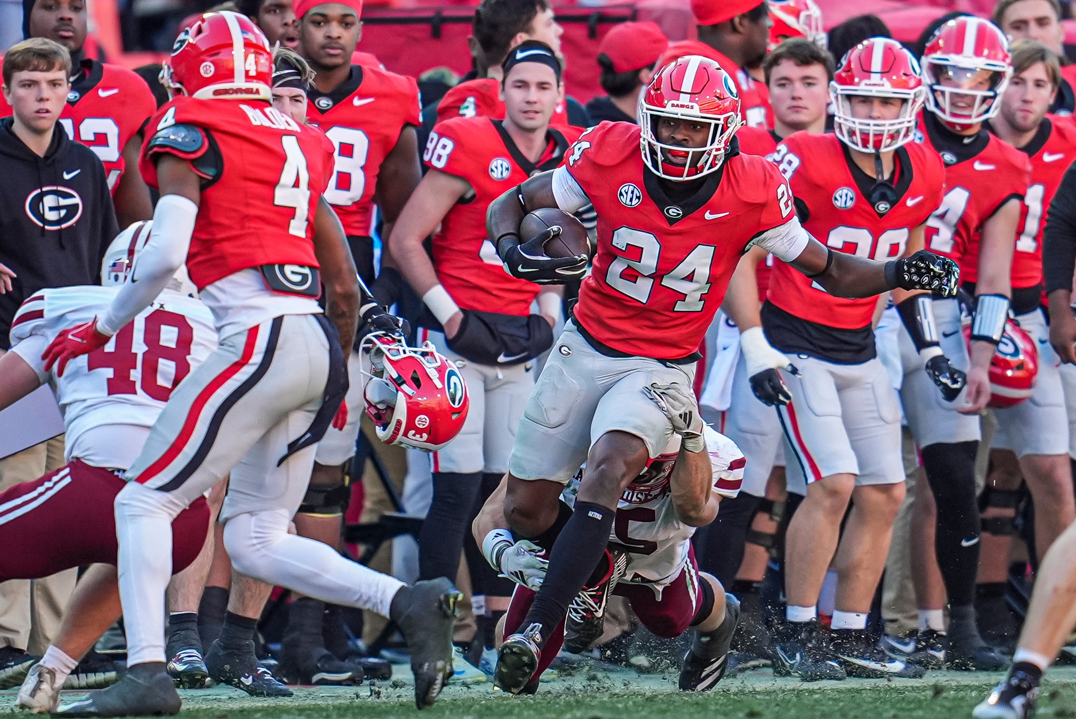 Nov 23, 2024; Athens, Georgia, USA; Georgia Bulldogs defensive back Malaki Starks (24) returns a punt against the Massachusetts Minutemen during the second half at Sanford Stadium.