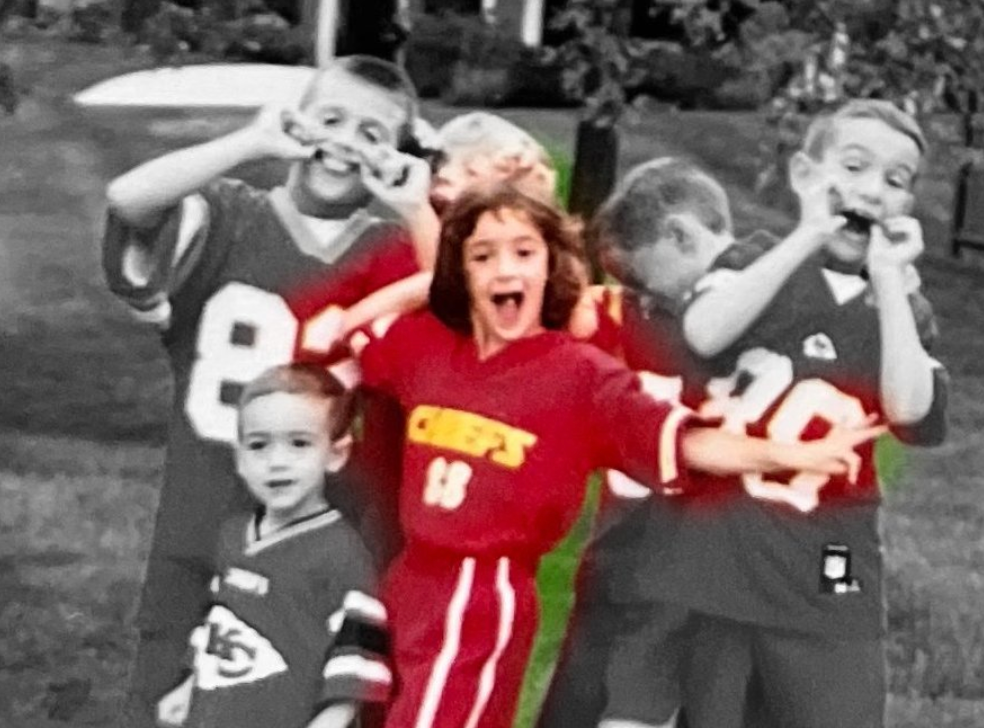 Caitlin Clark as a young girl in Kansas City Chiefs gear.