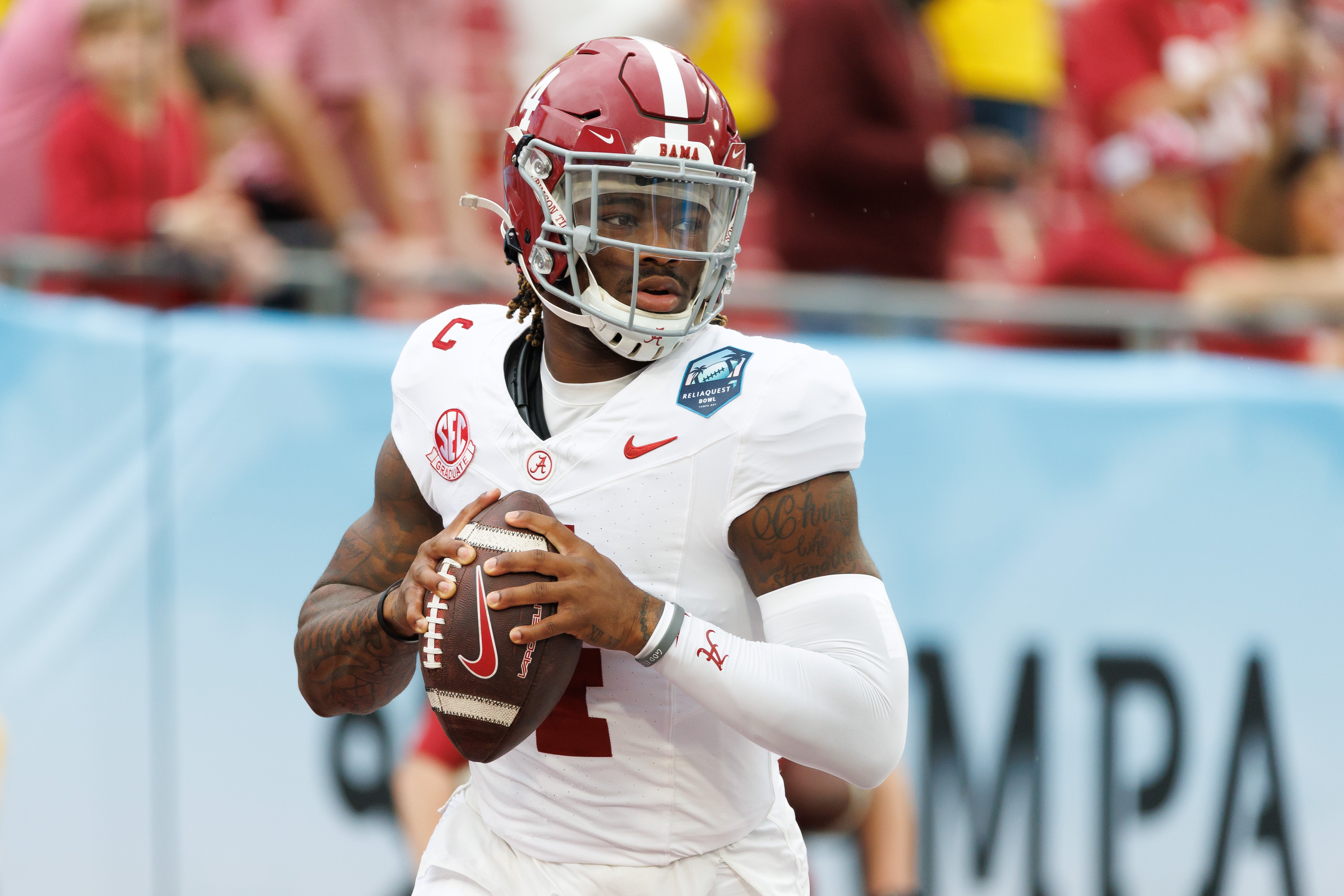 Dec 31, 2024; Tampa, FL, USA; Alabama Crimson Tide quarterback Jalen Milroe (4) looks to throw before a game against the Michigan Wolverines at Raymond James Stadium.