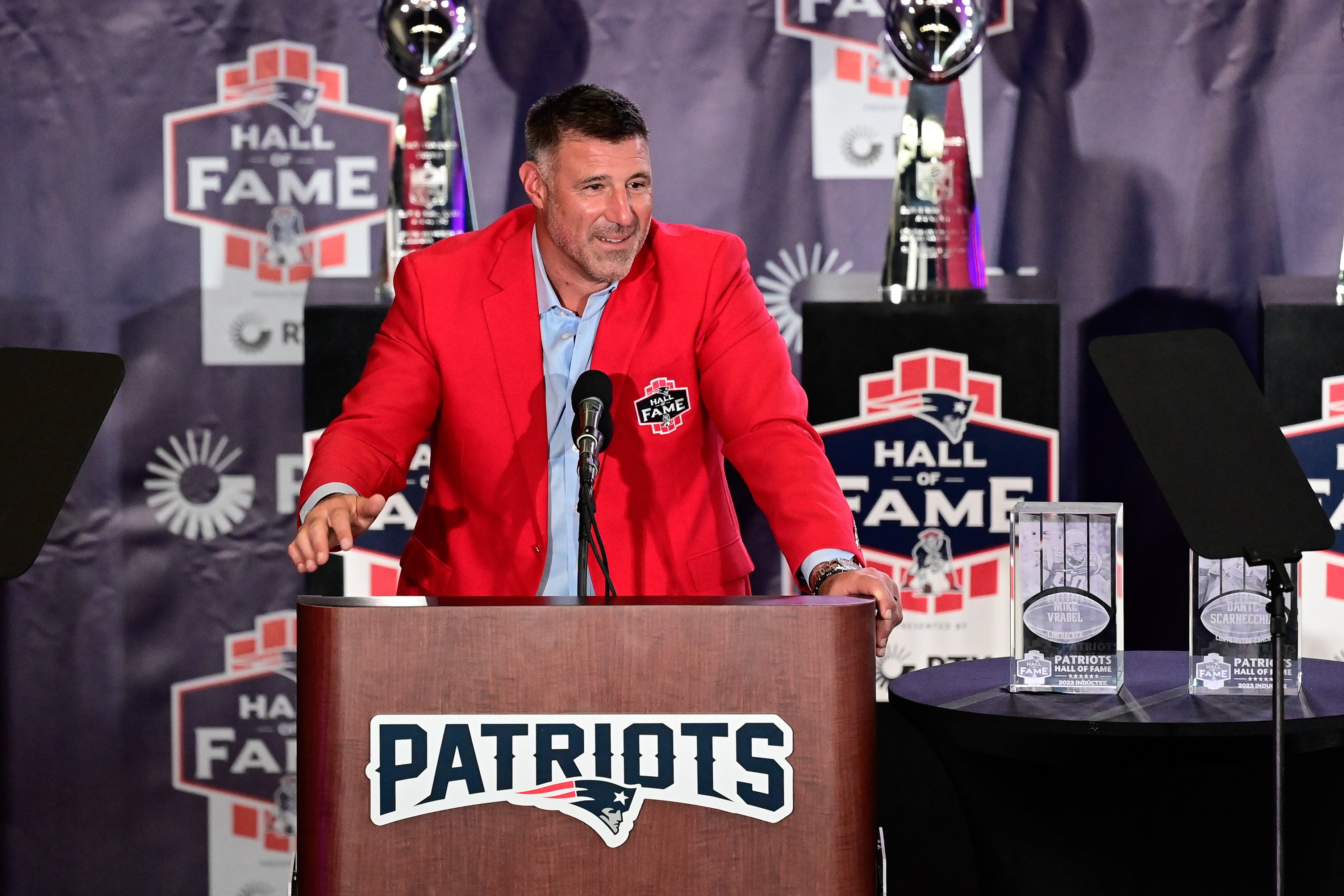 Oct 21, 2023; Foxborough, MA, USA; New England Patriots former line backer and current Tennessee Titans head coach Mike Vrabel makes a speech at his 2023 Patriots Hall of Fame induction in the Cross Insurance Pavilion at Gillette Stadium.