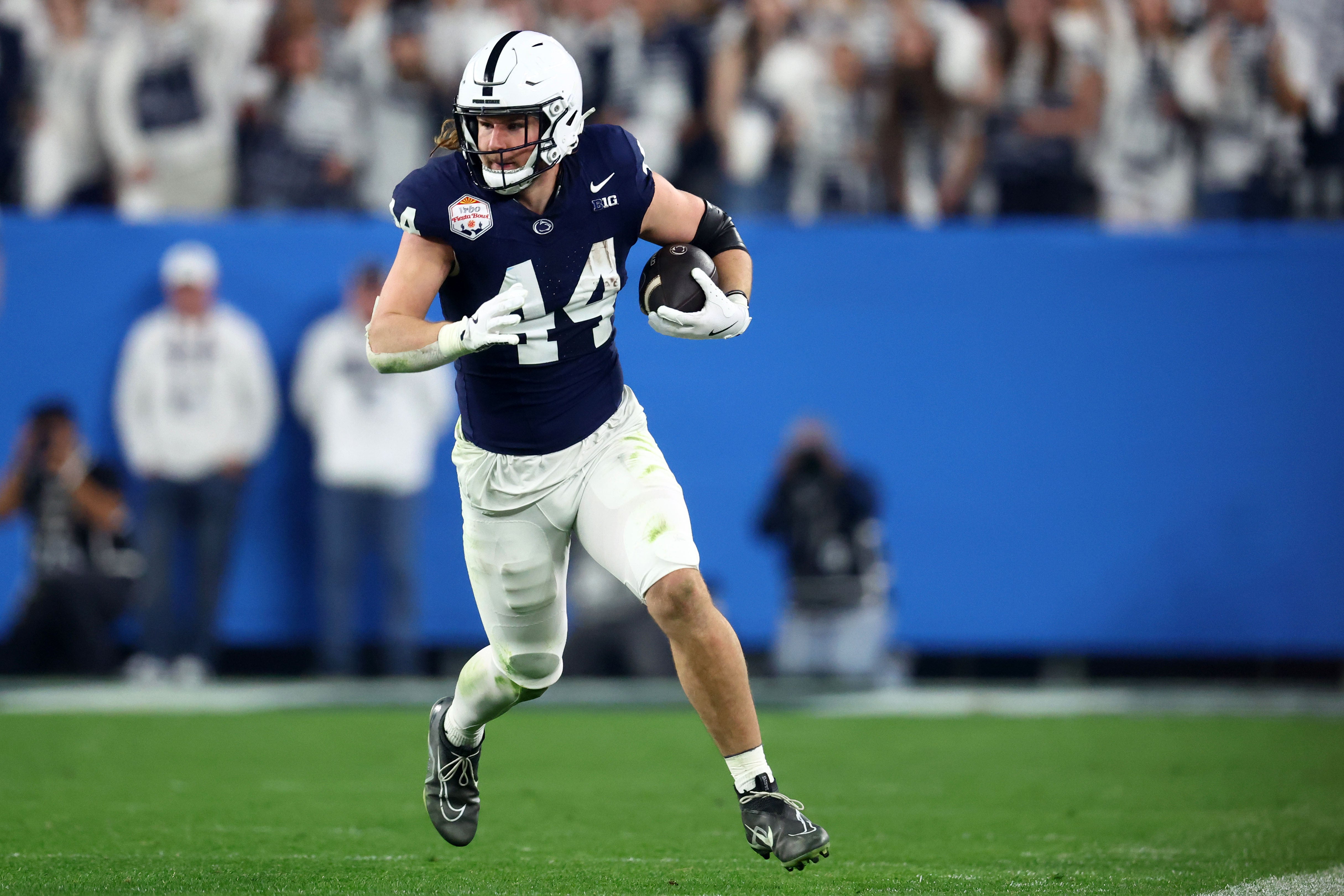 Dec 31, 2024; Glendale, AZ, USA; Penn State Nittany Lions tight end Tyler Warren (44) runs after a catch against the Boise State Broncos during the first half in the Fiesta Bowl at State Farm Stadium.