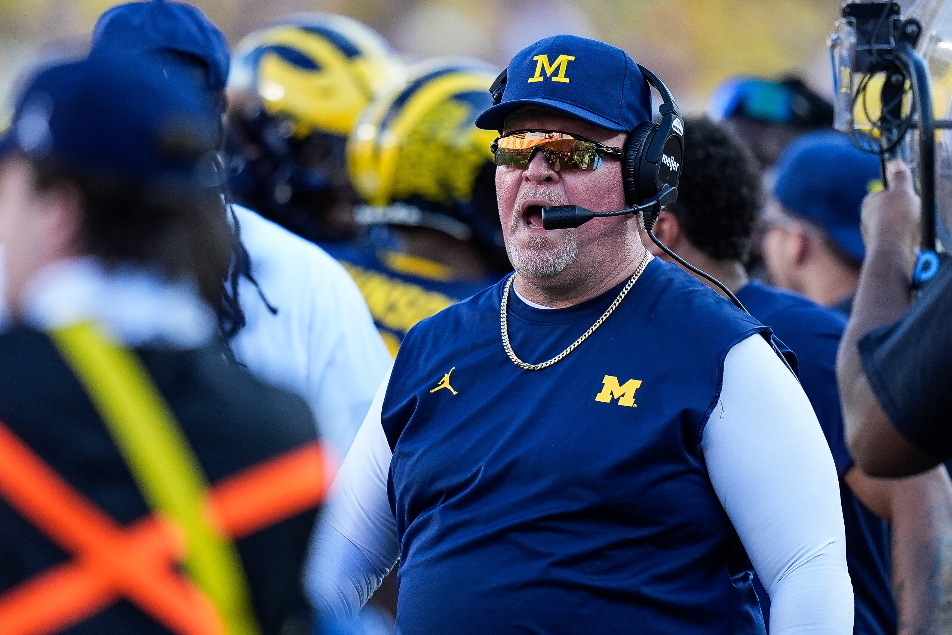 Michigan defensive coordinator Wink Martindale talks to players after a play against USC during the second half at Michigan Stadium in Ann Arbor on Saturday, Sept. 21, 2024.