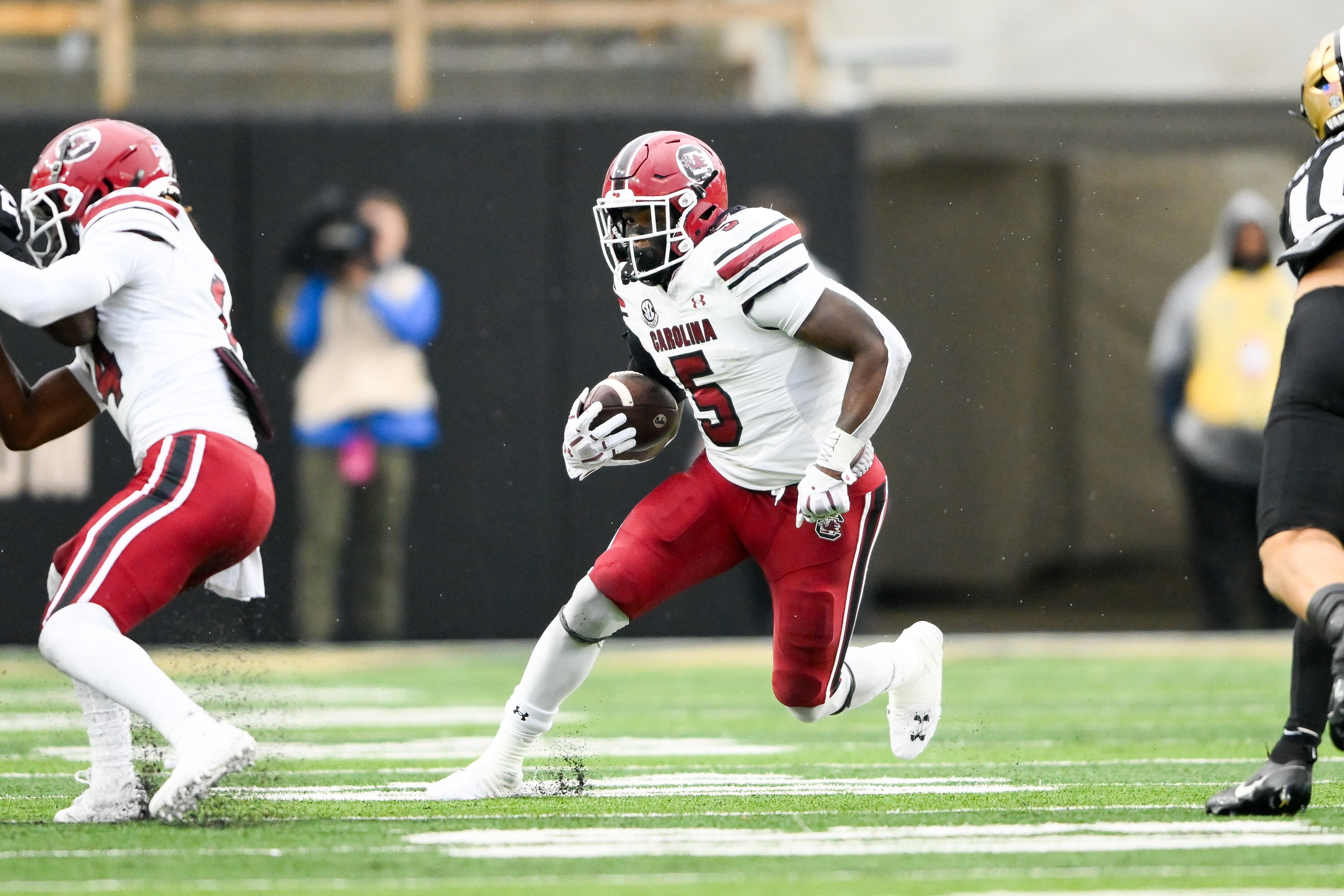 Nov 9, 2024; Nashville, Tennessee, USA; South Carolina Gamecocks running back Raheim Sanders (5) runs the ball against the Vanderbilt Commodores during the first half at FirstBank Stadium.