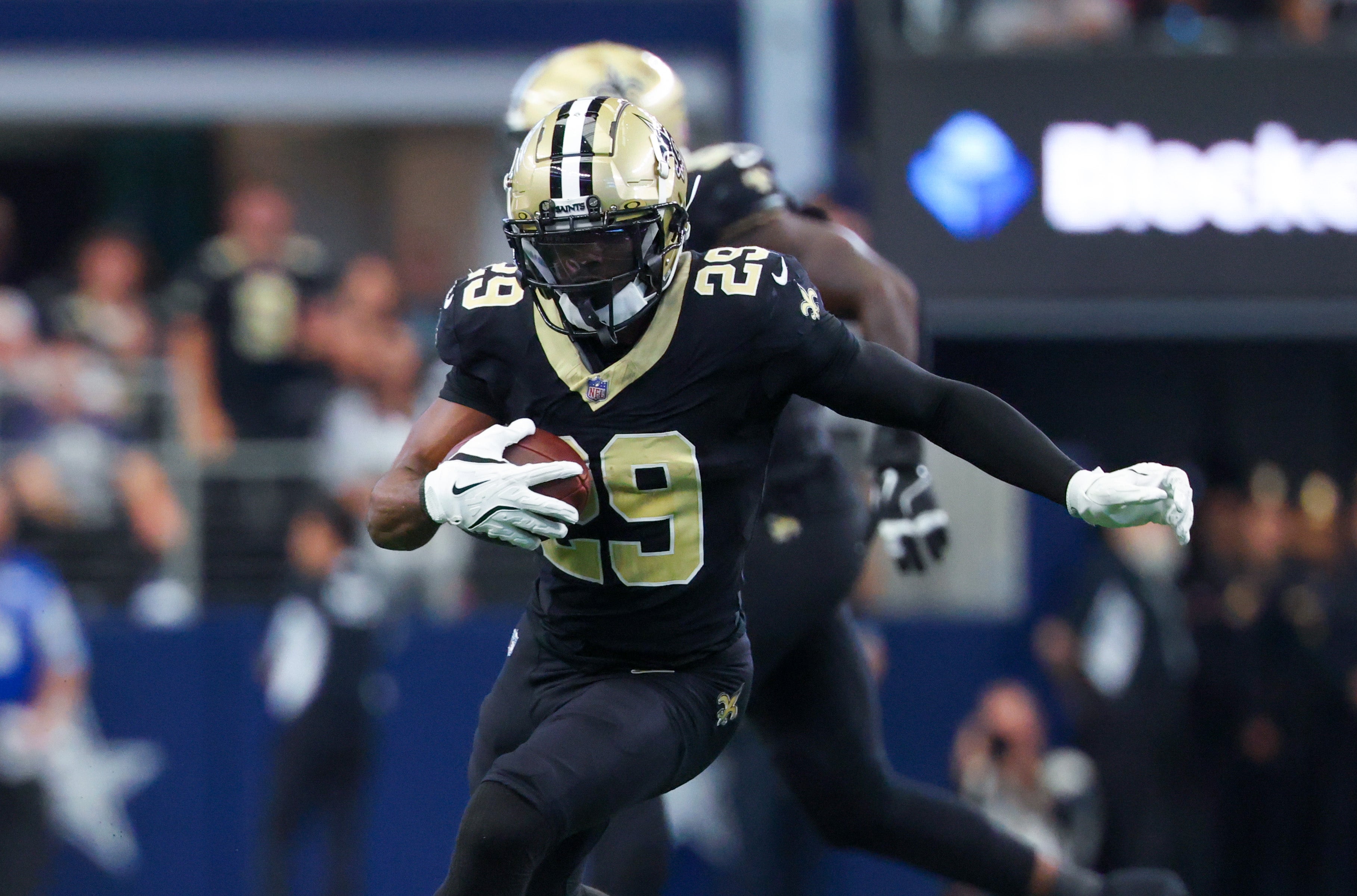 New Orleans Saints cornerback Paulson Adebo (29) intercepts a ball intended for Dallas Cowboys wide receiver Jalen Brooks (not pictured) during the first half at AT&T Stadium.