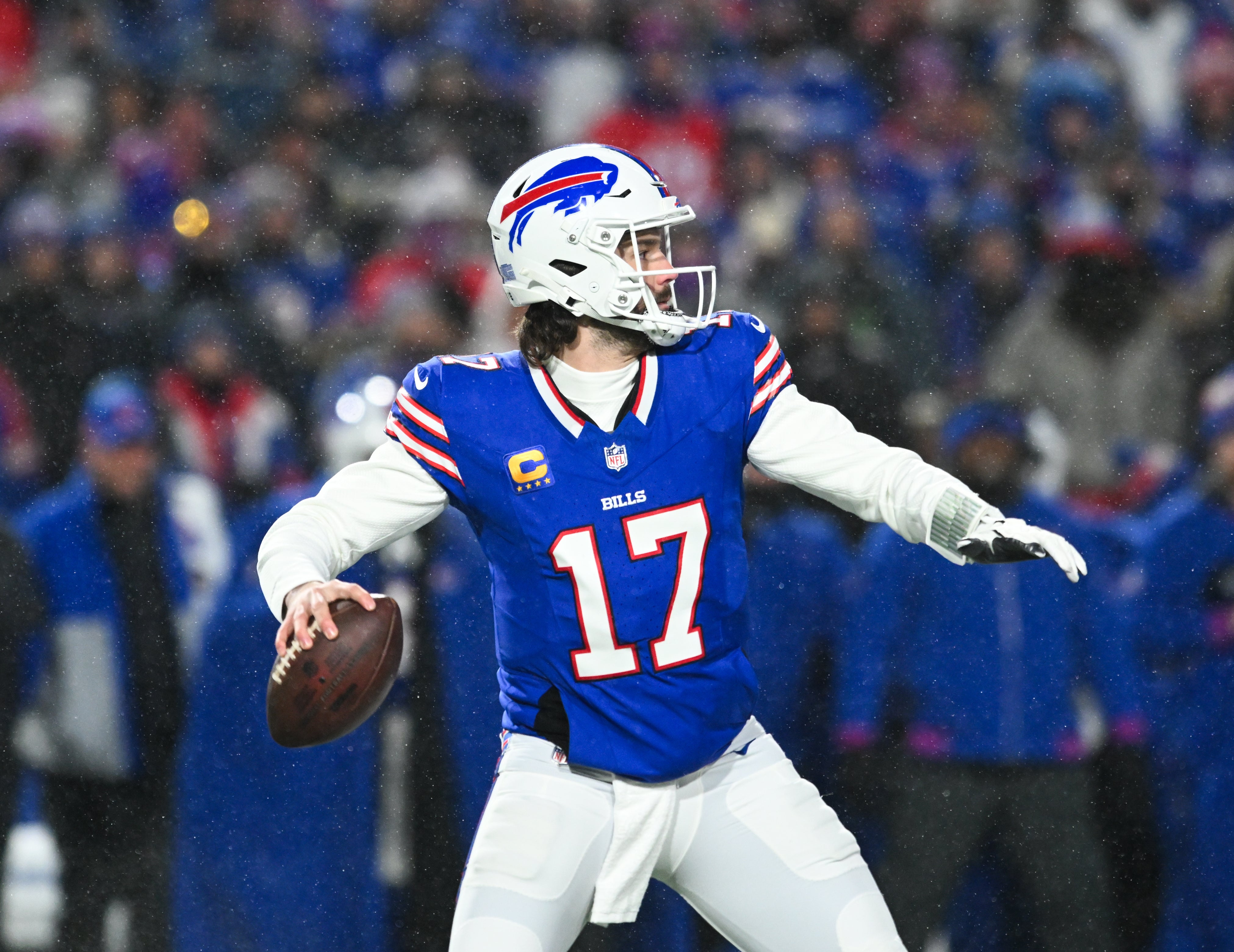 Jan 19, 2025; Orchard Park, New York, USA; Buffalo Bills quarterback Josh Allen (17) looks to throw during the first quarter against the Baltimore Ravens in a 2025 AFC divisional round game at Highmark Stadium.