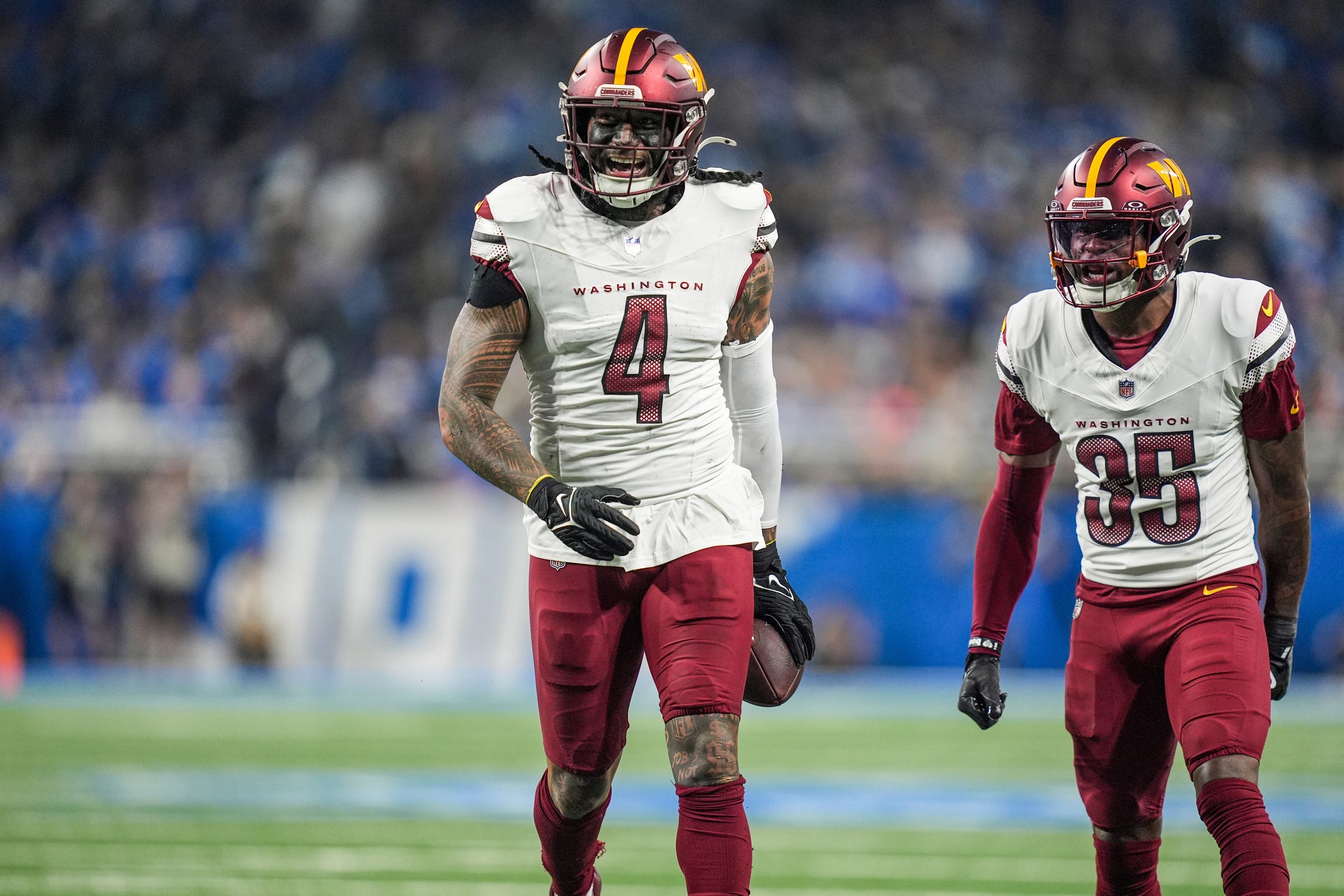 Washington Commanders linebacker Frankie Luvu (4) smiles after a play in the first half against the Detroit Lions in the NFC divisional round at Ford Field in Detroit on Saturday, Jan. 18, 2025.
