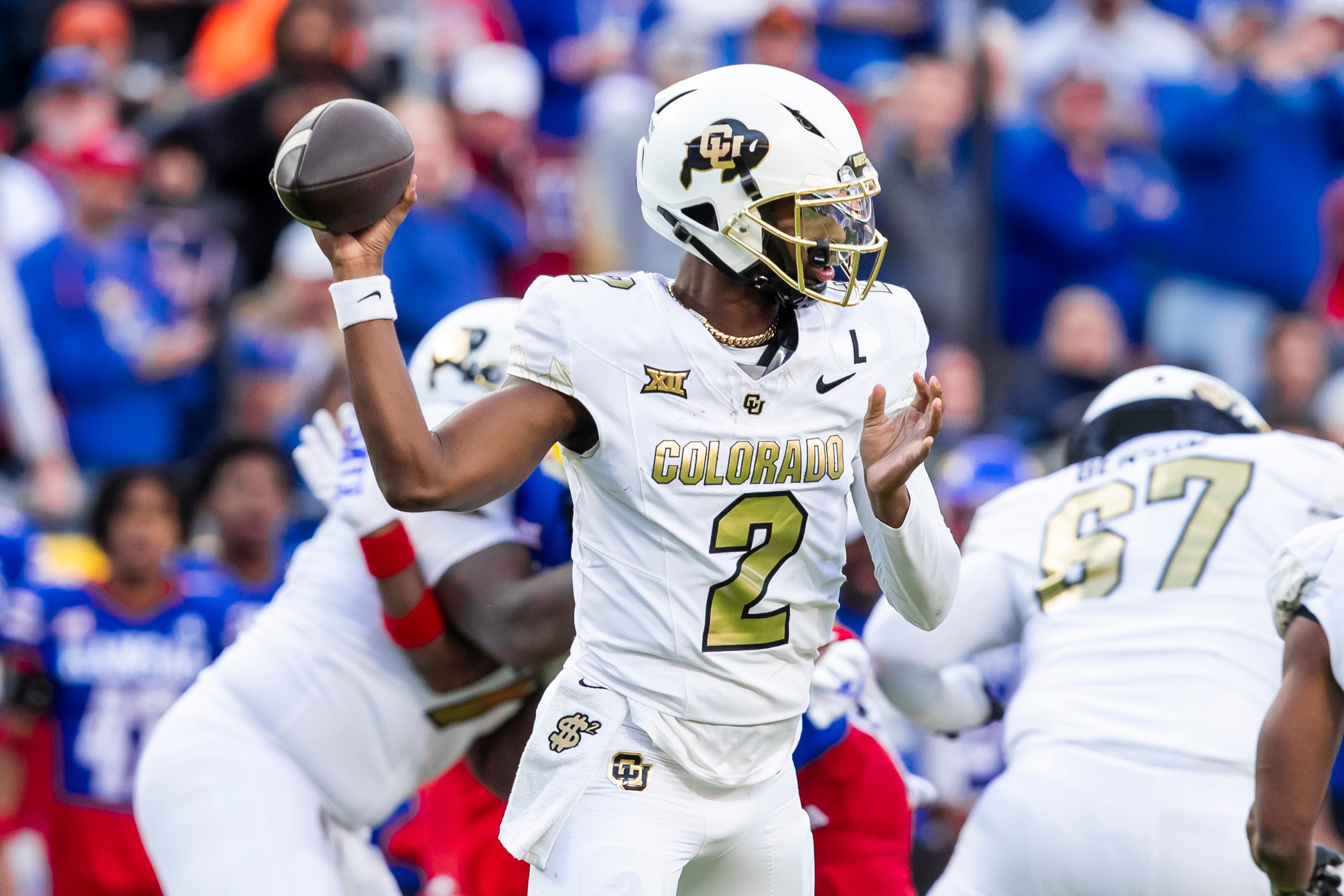 Nov 23, 2024; Kansas City, Missouri, USA; Colorado quarterback Shedeur Sanders (2) passes the ball during the 2nd quarter between the Kansas Jayhawks and the Colorado Buffaloes at GEHA Field at Arrowhead Stadium.