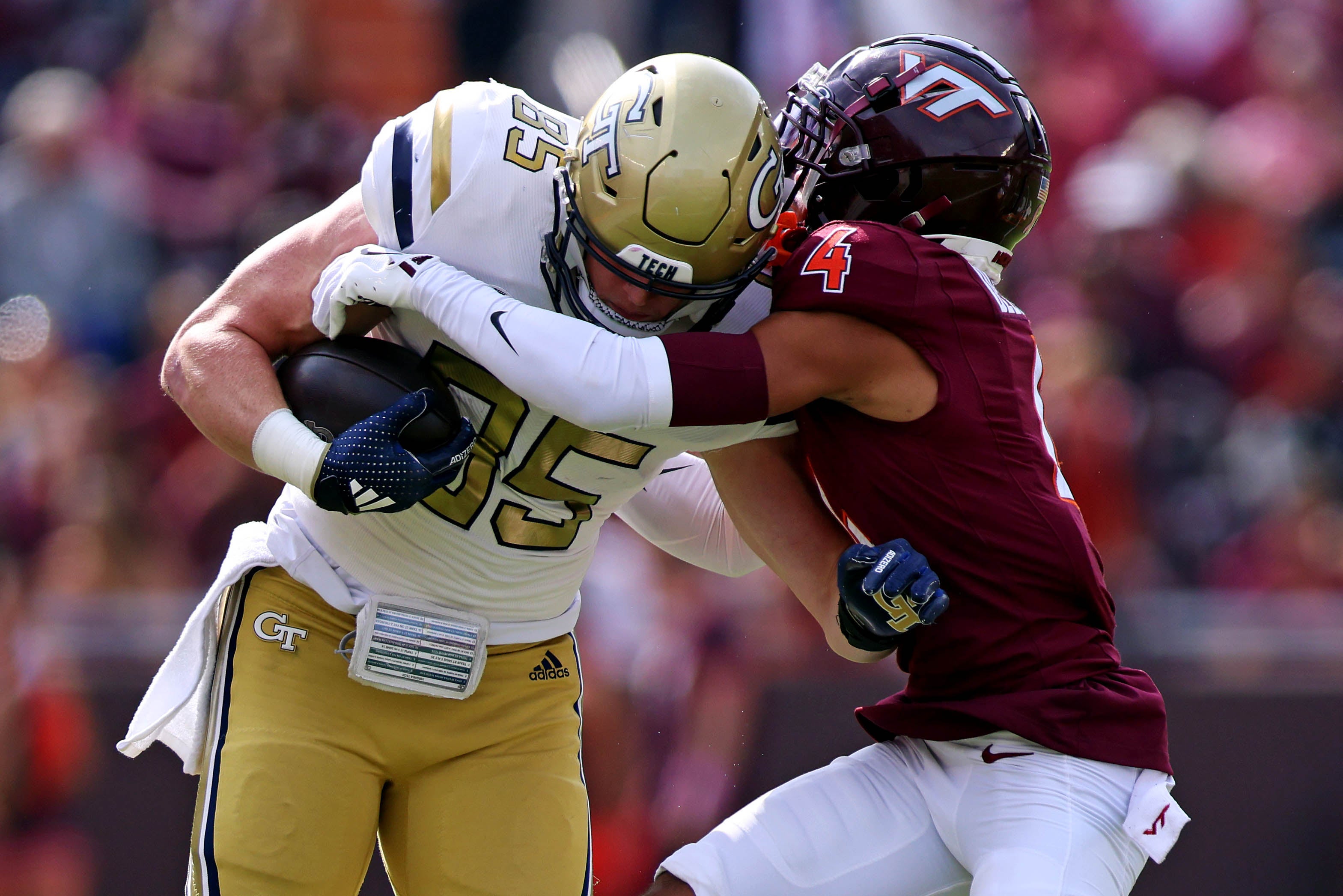 Oct 26, 2024; Blacksburg, Virginia, USA; Georgia Tech Yellow Jackets tight end Jackson Hawes (85) runs the ball after a catch against Virginia Tech Hokies cornerback Mansoor Delane (4) during the first quarter at Lane Stadium.