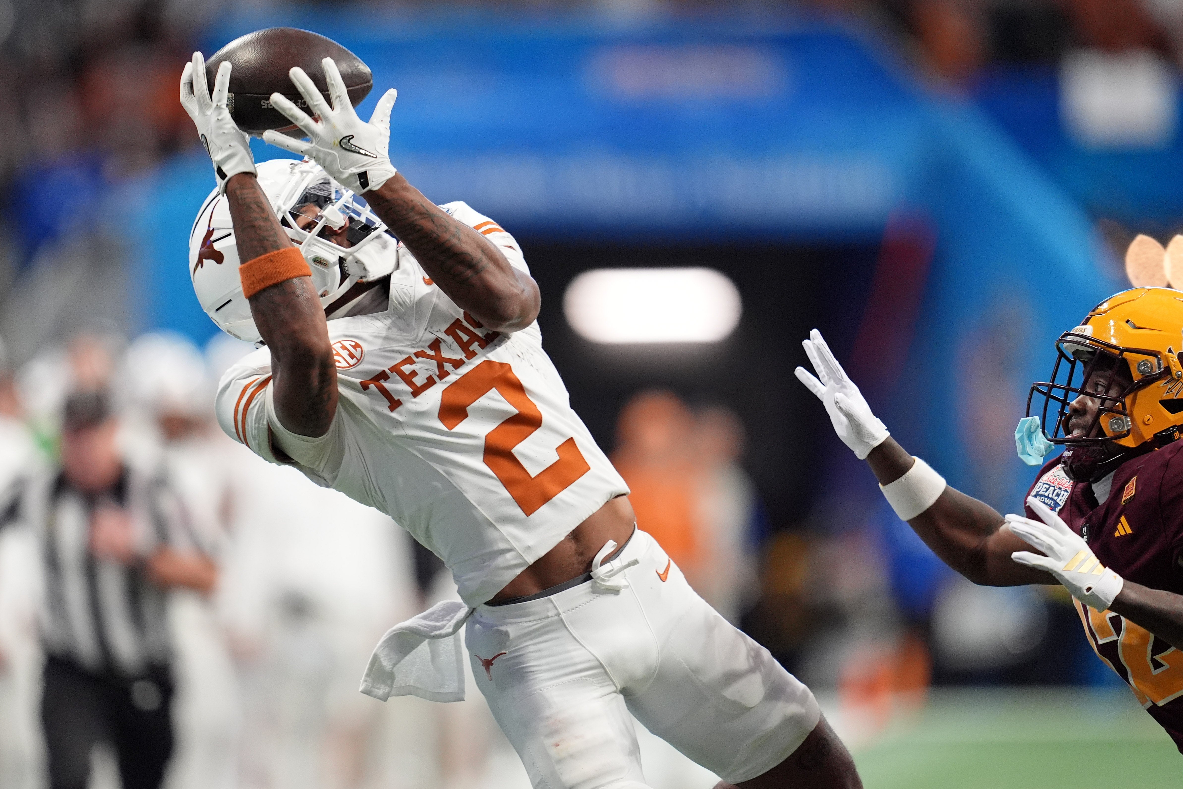 Jan 1, 2025; Atlanta, GA, USA; Texas Longhorns wide receiver Matthew Golden (2) makes a catch against the Arizona State Sun Devils during the second half of the Peach Bowl at Mercedes-Benz Stadium.