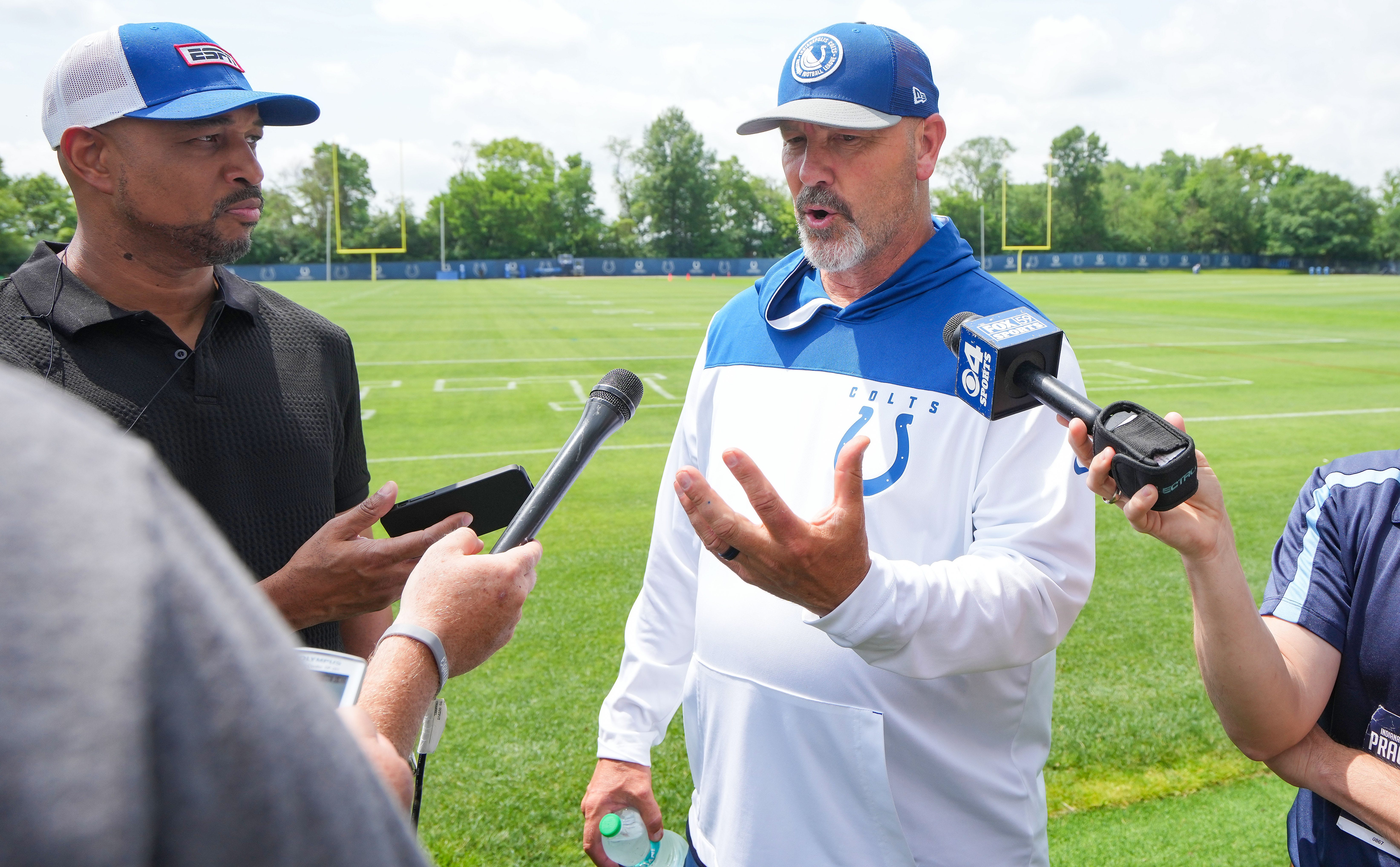 Colts defensive coordinator Gus Bradley talks with press Wednesday, June 5, 2024, ahead of practice at the Colts Practice Facility in Indianapolis.
