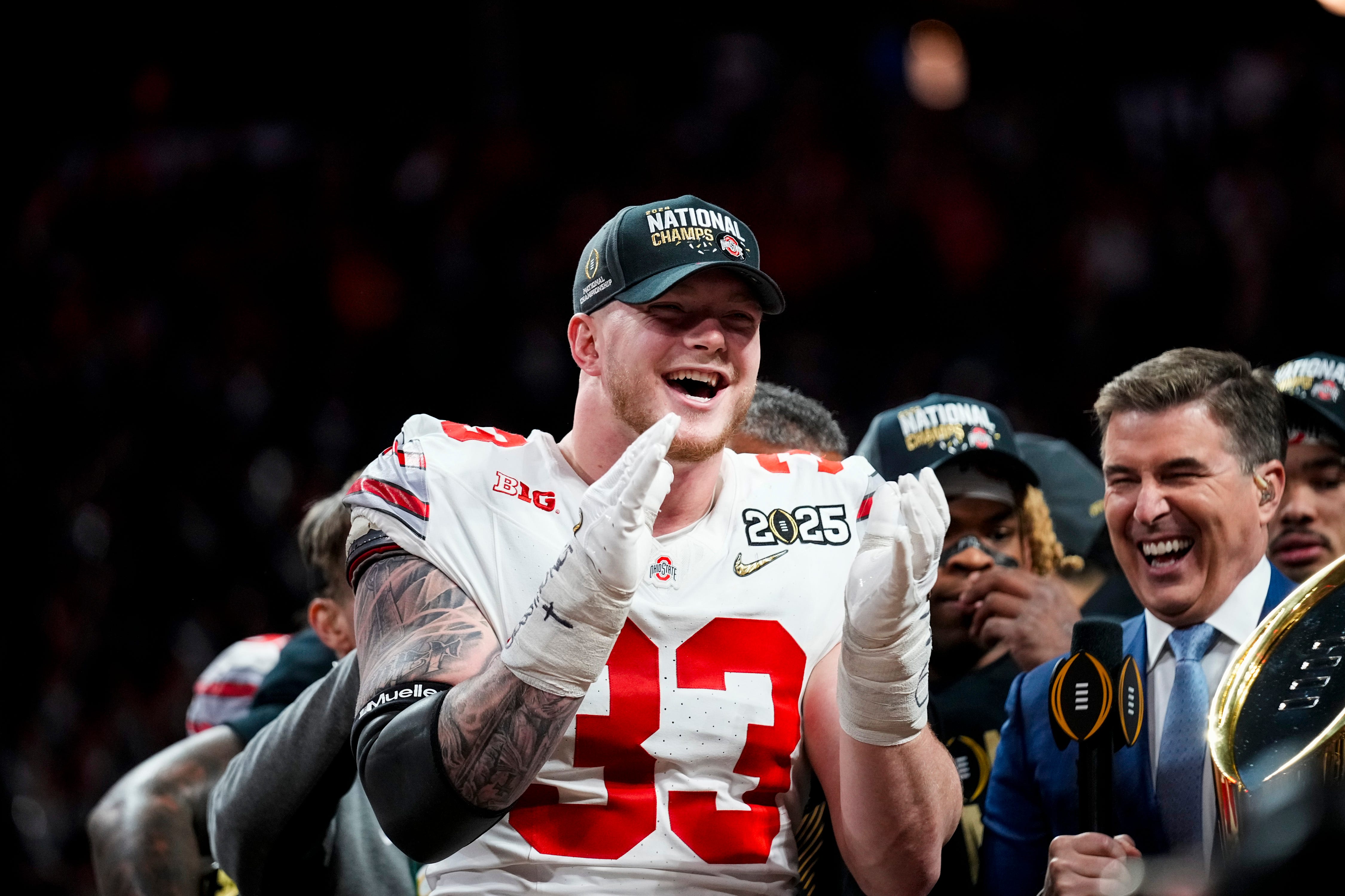 Ohio State Buckeyes defensive end Jack Sawyer (33) celebrates after defeating Notre Dame Fighting Irish in the College Football Playoff championship game at Mercedes-Benz Stadium in Atlanta on Jan. 21, 2025.