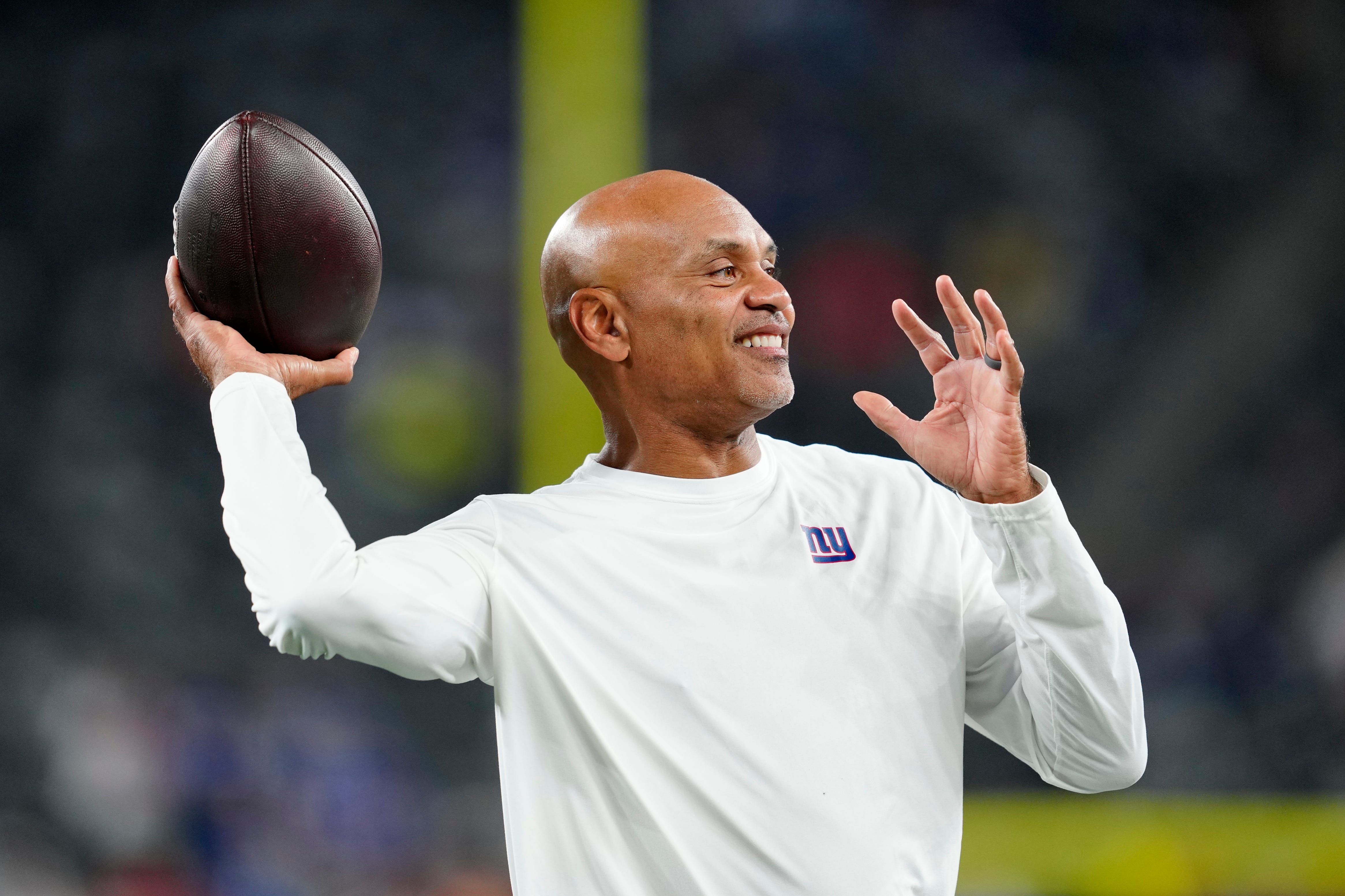Jerome Henderson, Giants Defensive Back Coach plays catch with fans before the game at MetLife Stadium, Sunday, October 13, 2024, in East Rutherford.
