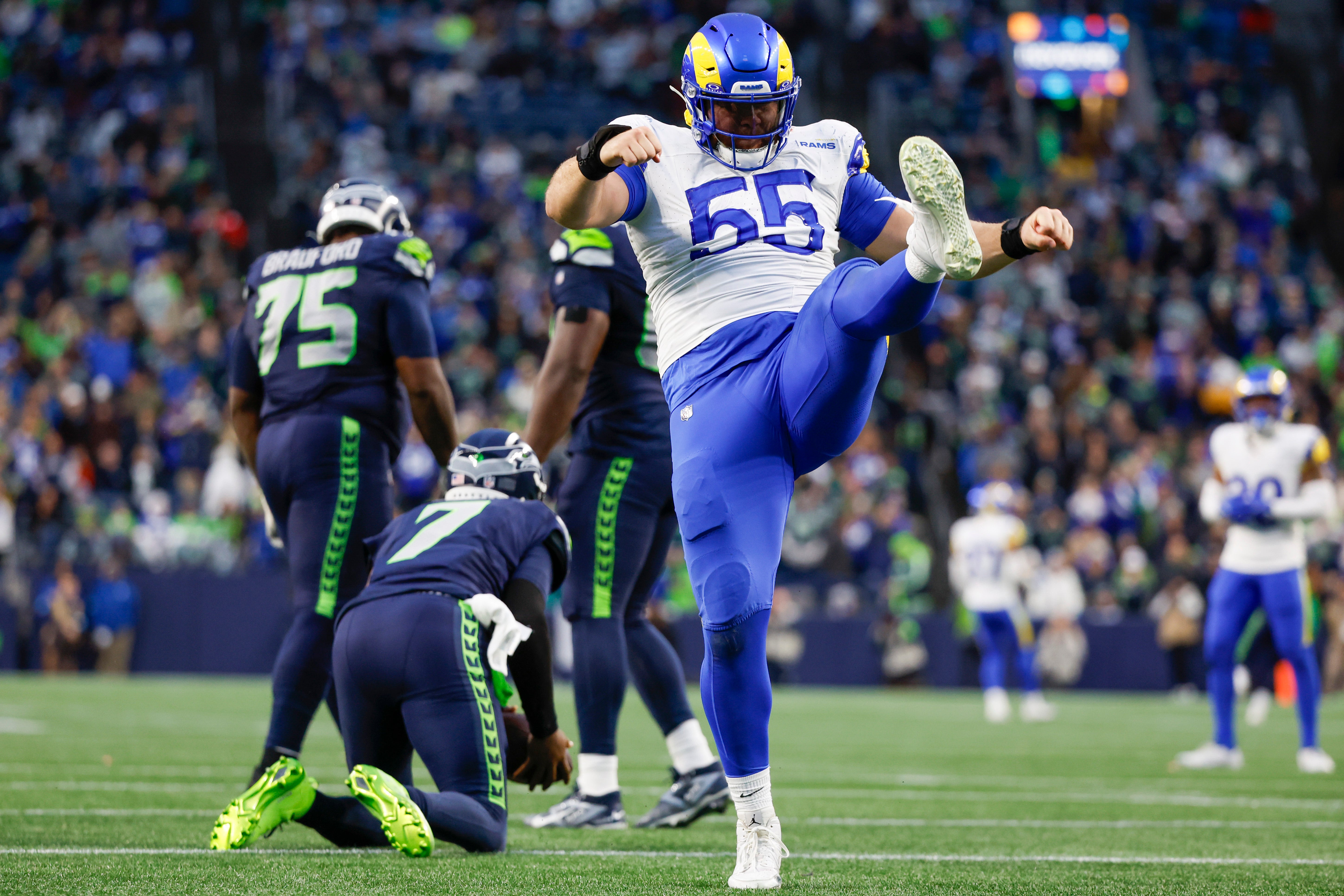 Nov 3, 2024; Seattle, Washington, USA; Los Angeles Rams defensive tackle Braden Fiske (55) celebrates following a sack against Seattle Seahawks quarterback Geno Smith (7) during the fourth quarter at Lumen Field.