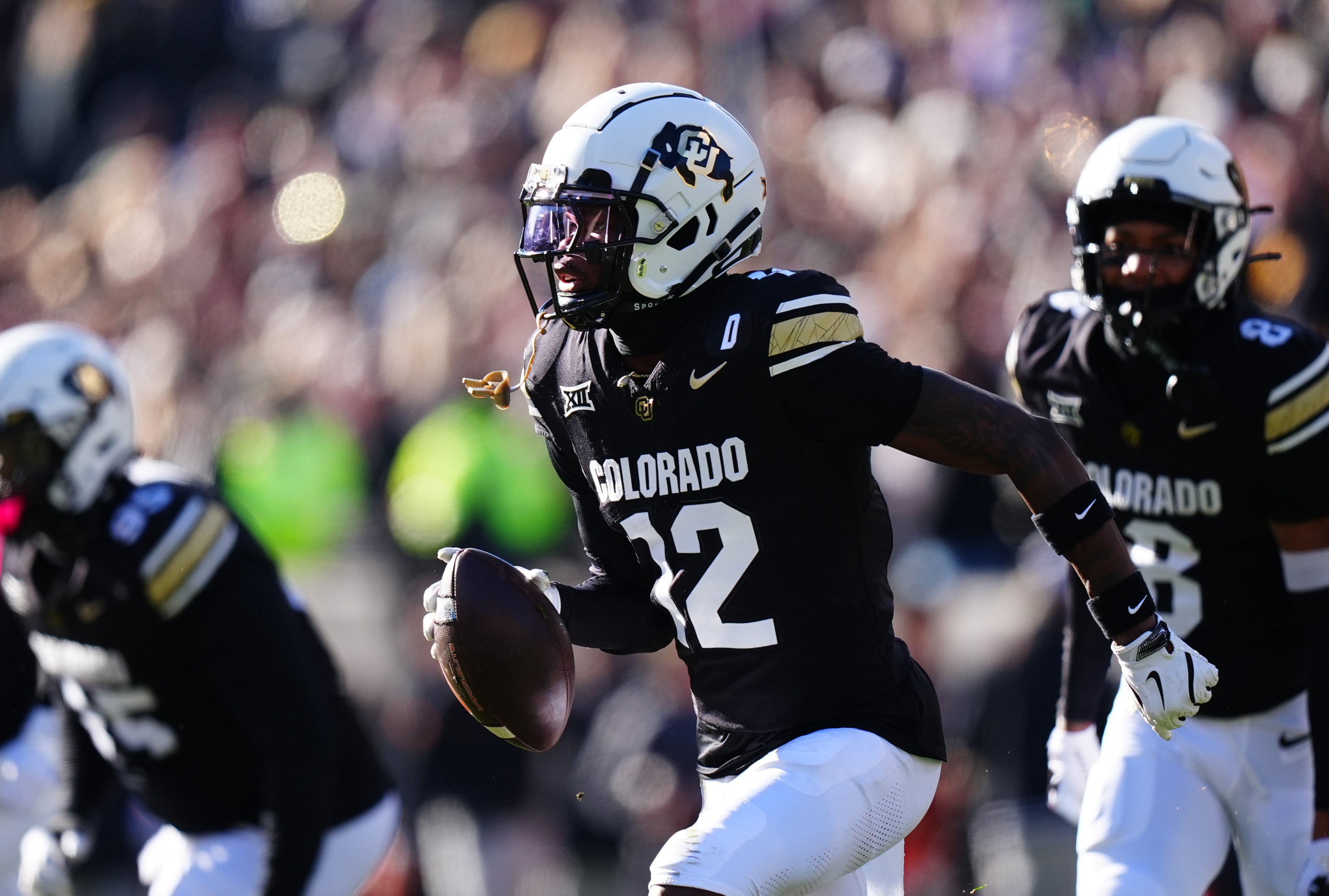 Nov 29, 2024; Boulder, Colorado, USA; Colorado Buffaloes cornerback Travis Hunter (12) following an interception in the first quarter against the Oklahoma State Cowboys at Folsom Field.
