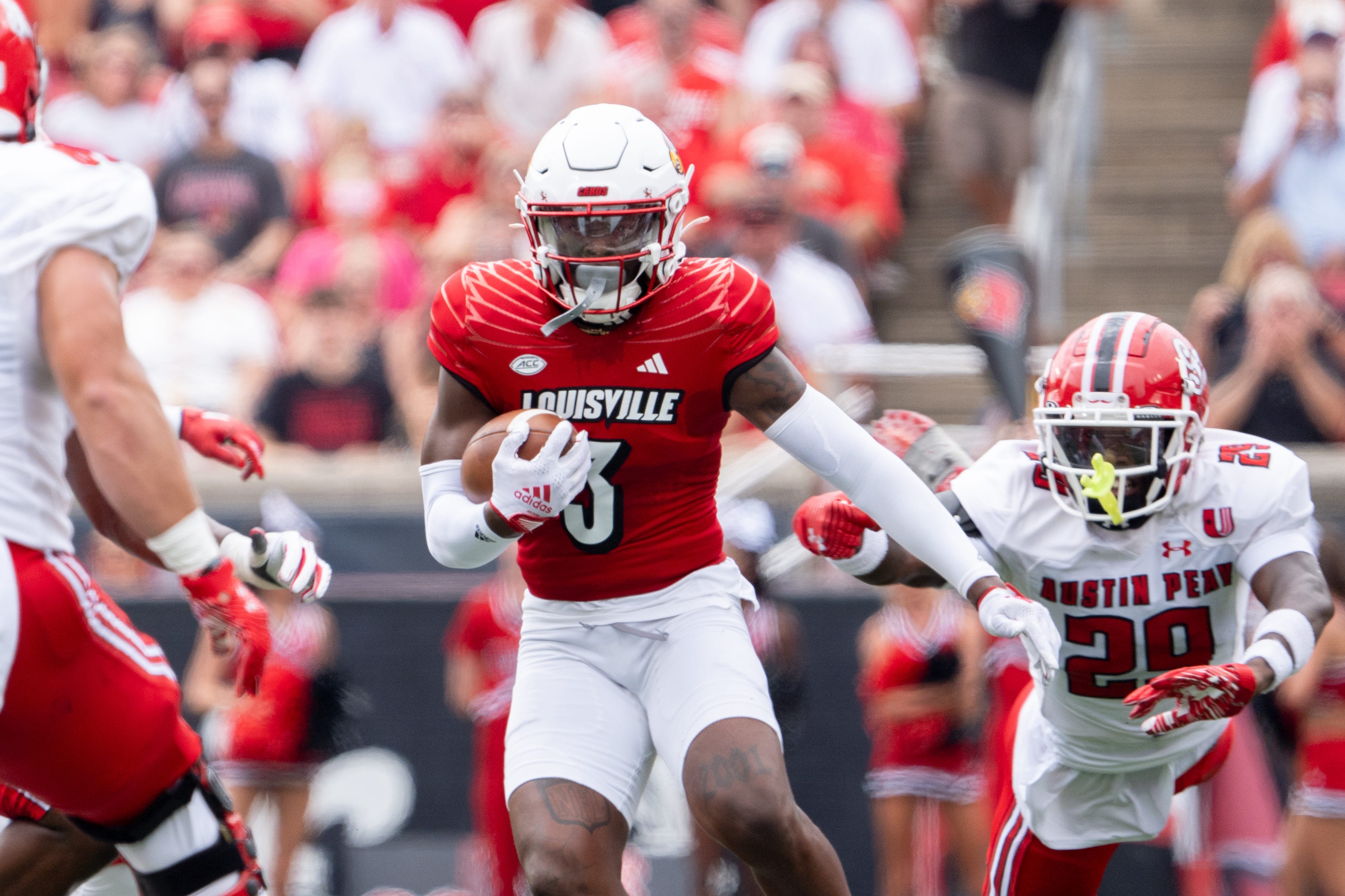 Louisville Cardinals defensive back Quincy Riley (3) runs the ball down the field during their game against the Austin Peay Governors on Saturday, Aug. 31, 2024 at L&N Federal Credit Union Stadium in Louisville, Ky.