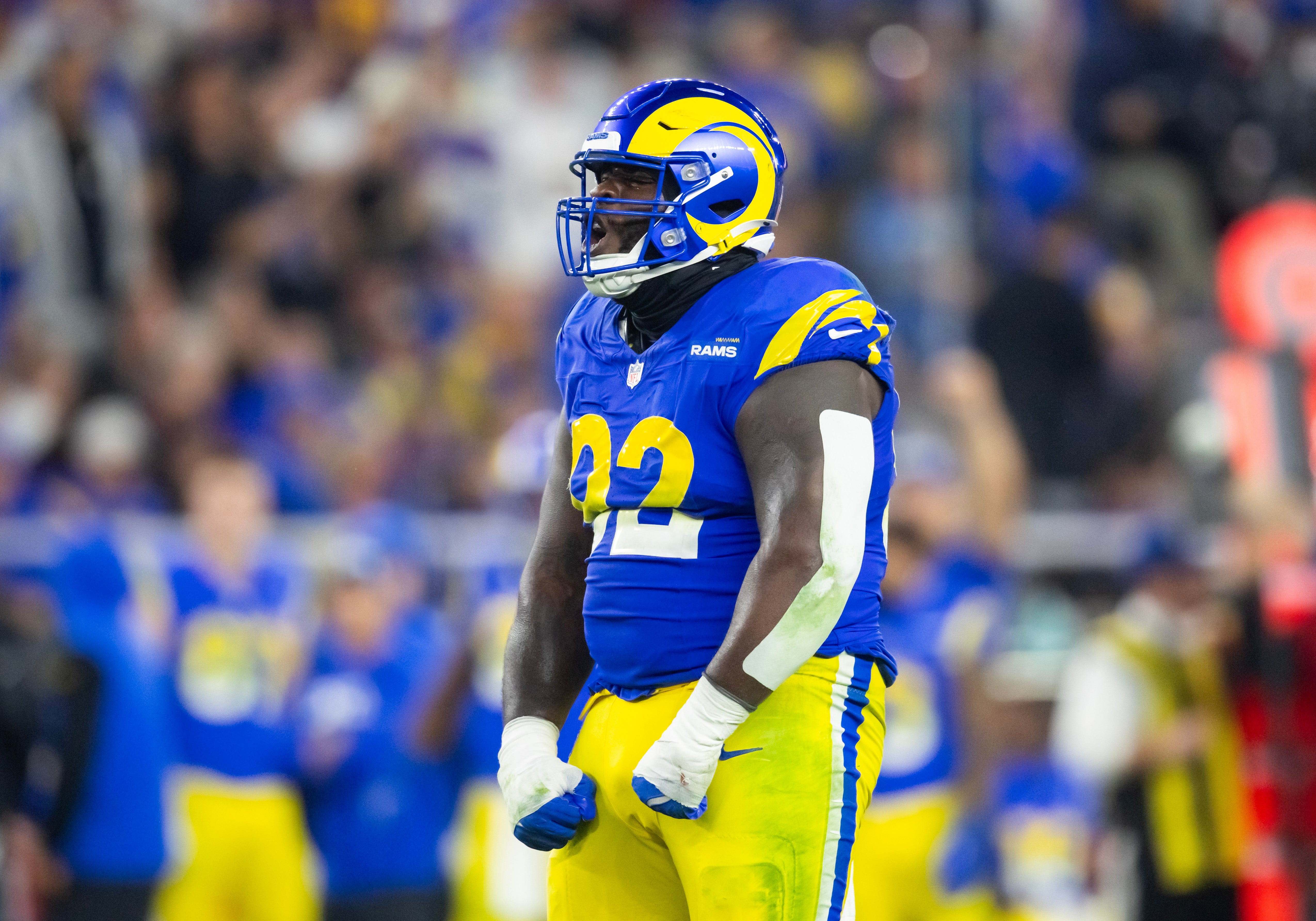 Jan 13, 2025; Glendale, AZ, USA; Los Angeles Rams defensive tackle Neville Gallimore (92) celebrates a play against the Minnesota Vikings during an NFC wild card game at State Farm Stadium.