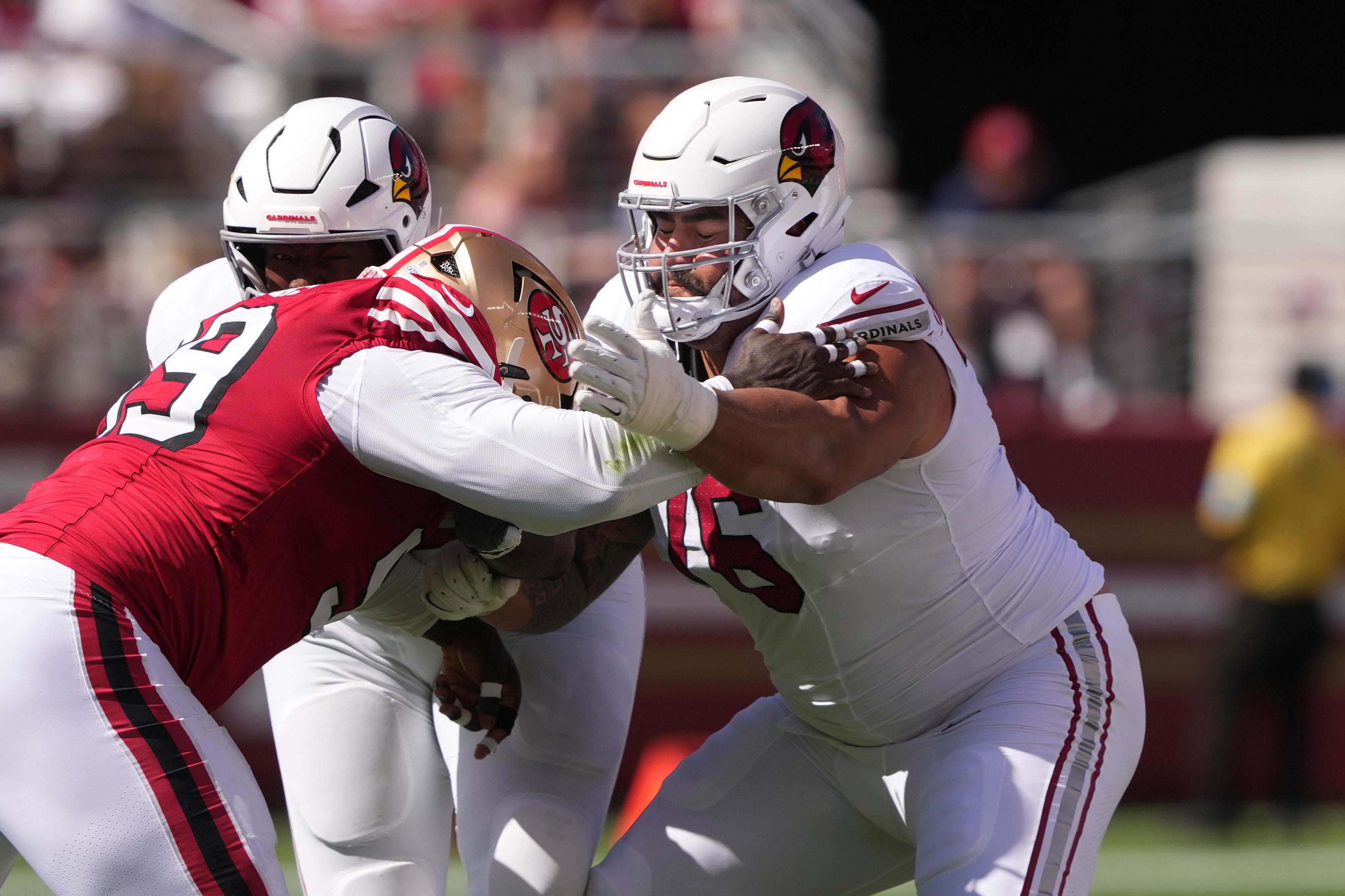 Oct 6, 2024; Santa Clara, California, USA; Arizona Cardinals guard Will Hernandez (right) blocks San Francisco 49ers defensive tackle Maliek Collins (left) during the second quarter at Levi's Stadium.