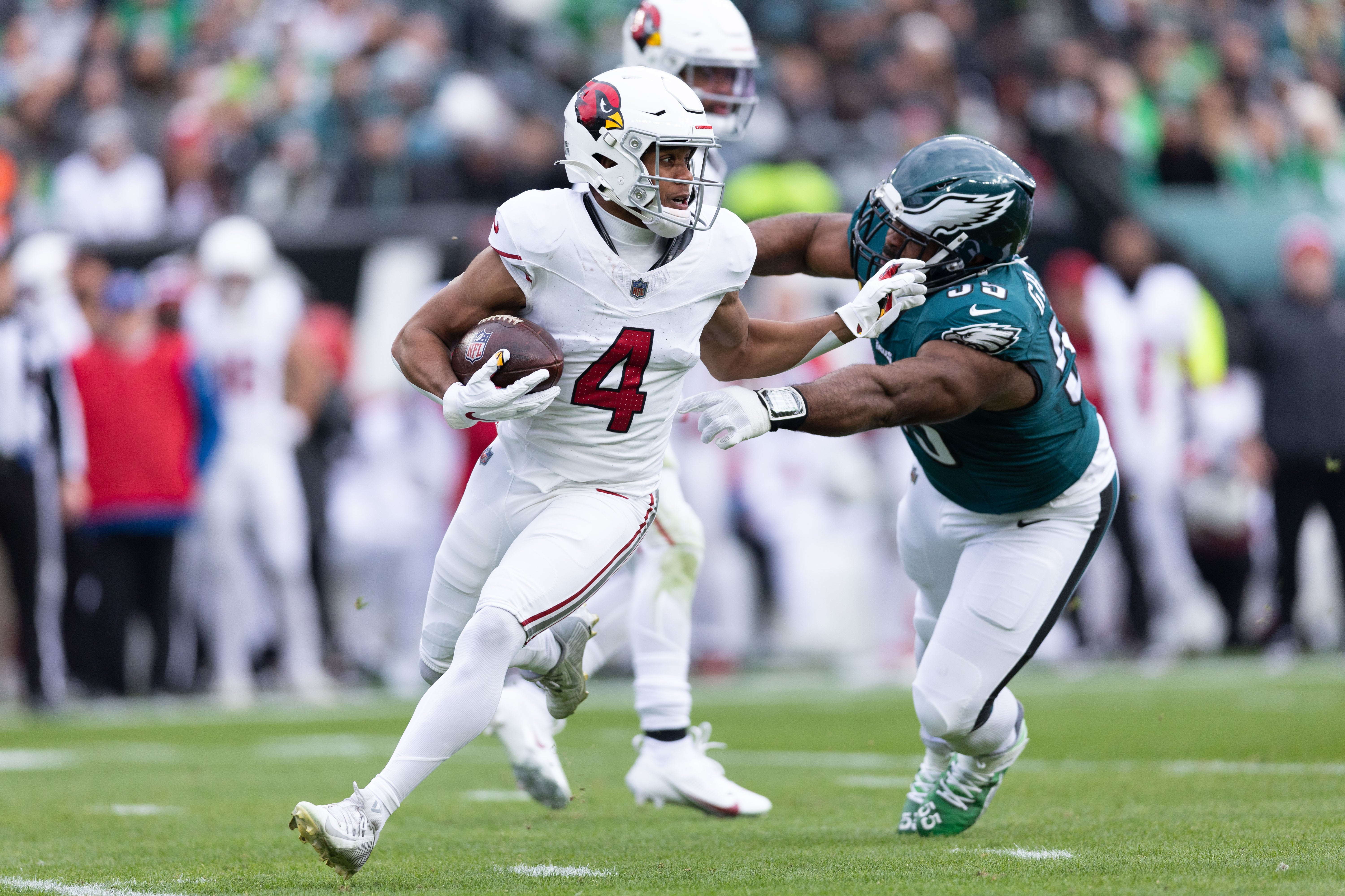 Dec 31, 2023; Philadelphia, Pennsylvania, USA; Arizona Cardinals wide receiver Rondale Moore (4) and Philadelphia Eagles defensive end Brandon Graham (55) in action during the second quarter at Lincoln Financial Field.