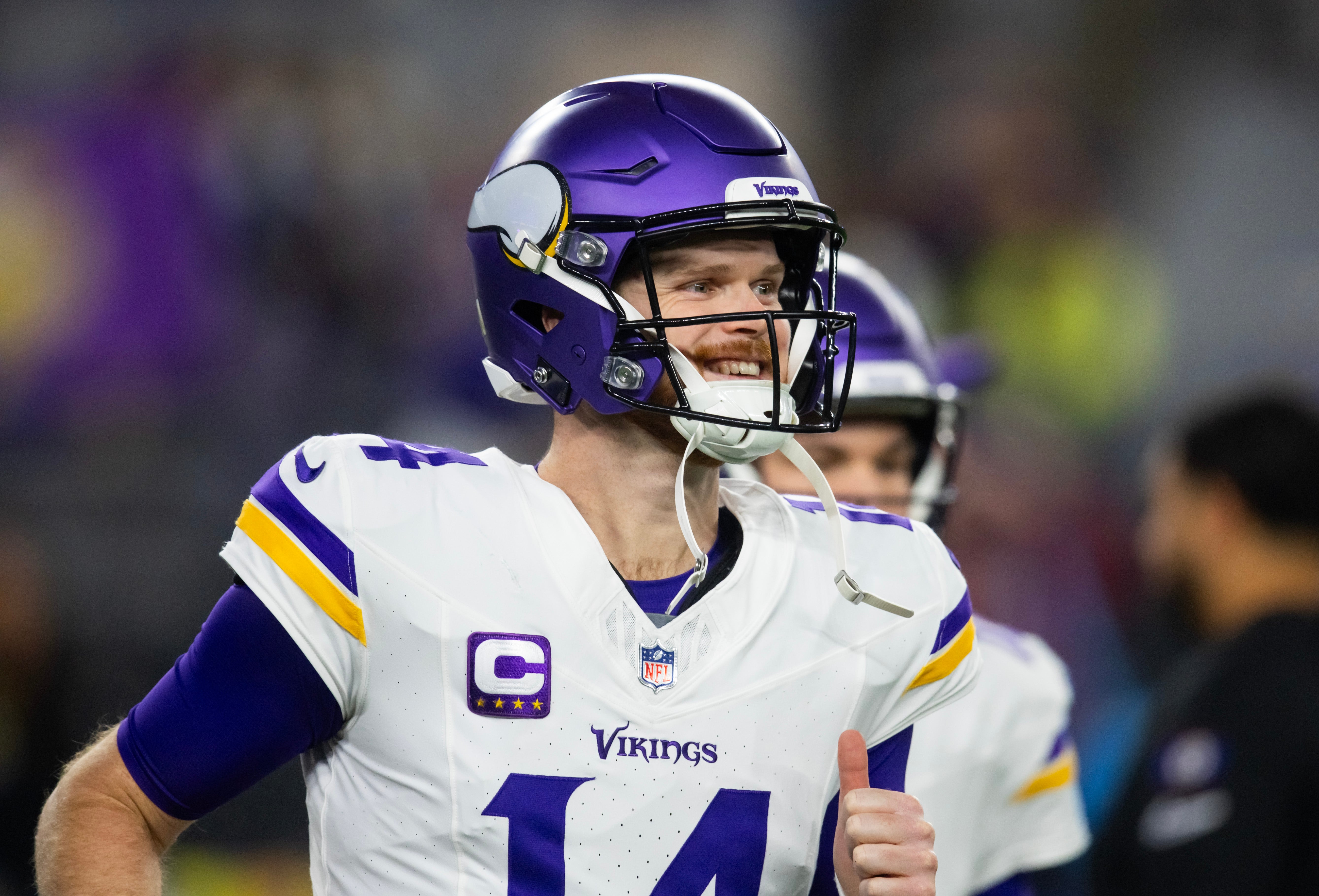 Jan 13, 2025; Glendale, AZ, USA; Minnesota Vikings quarterback Sam Darnold (14) against the Los Angeles Rams during an NFC wild card game at State Farm Stadium.