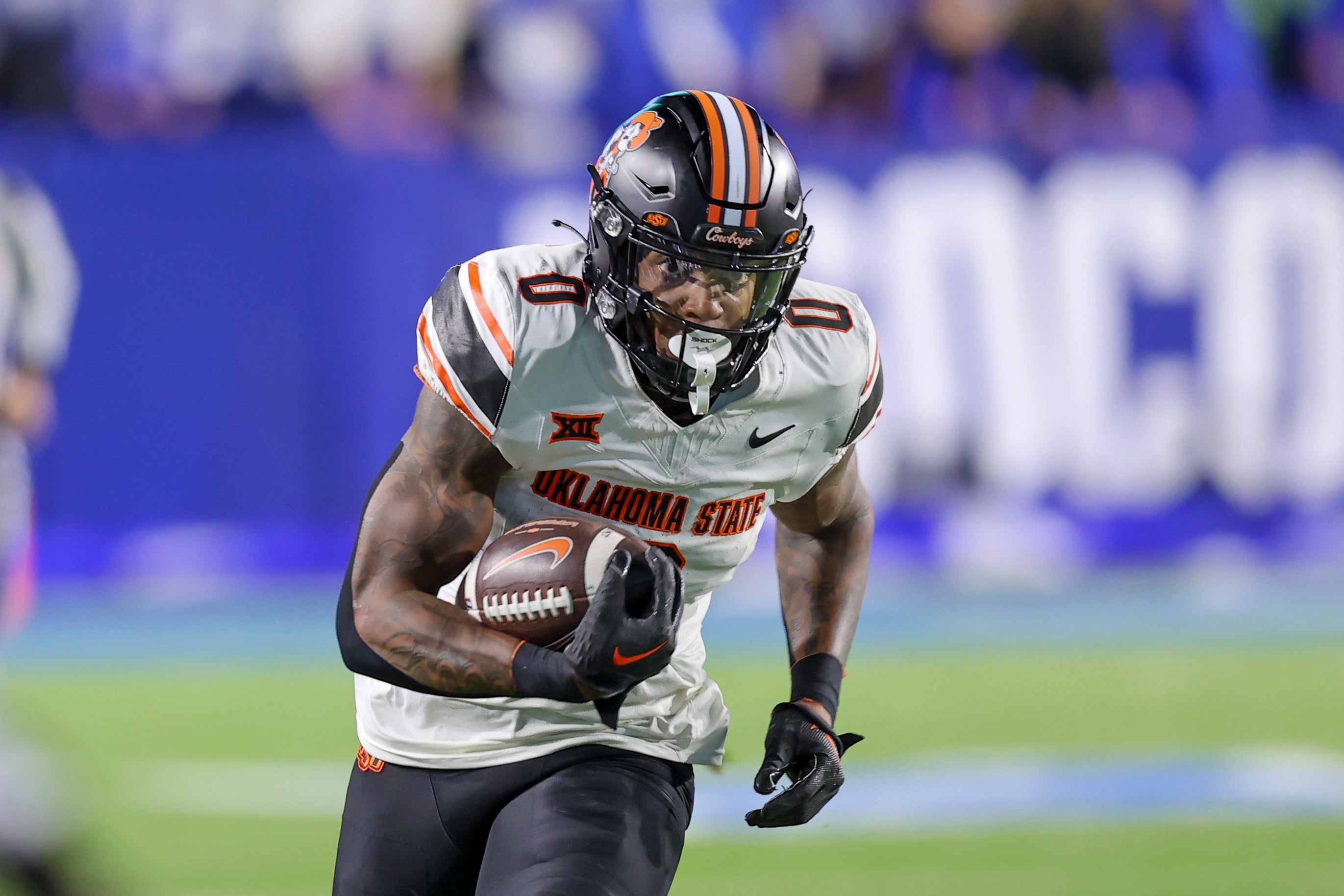 Oct 18, 2024; Provo, Utah, USA; Oklahoma State Cowboys running back Ollie Gordon II (0) runs for a catch for a touchdown against the Brigham Young Cougars during the first quarter at LaVell Edwards Stadium.