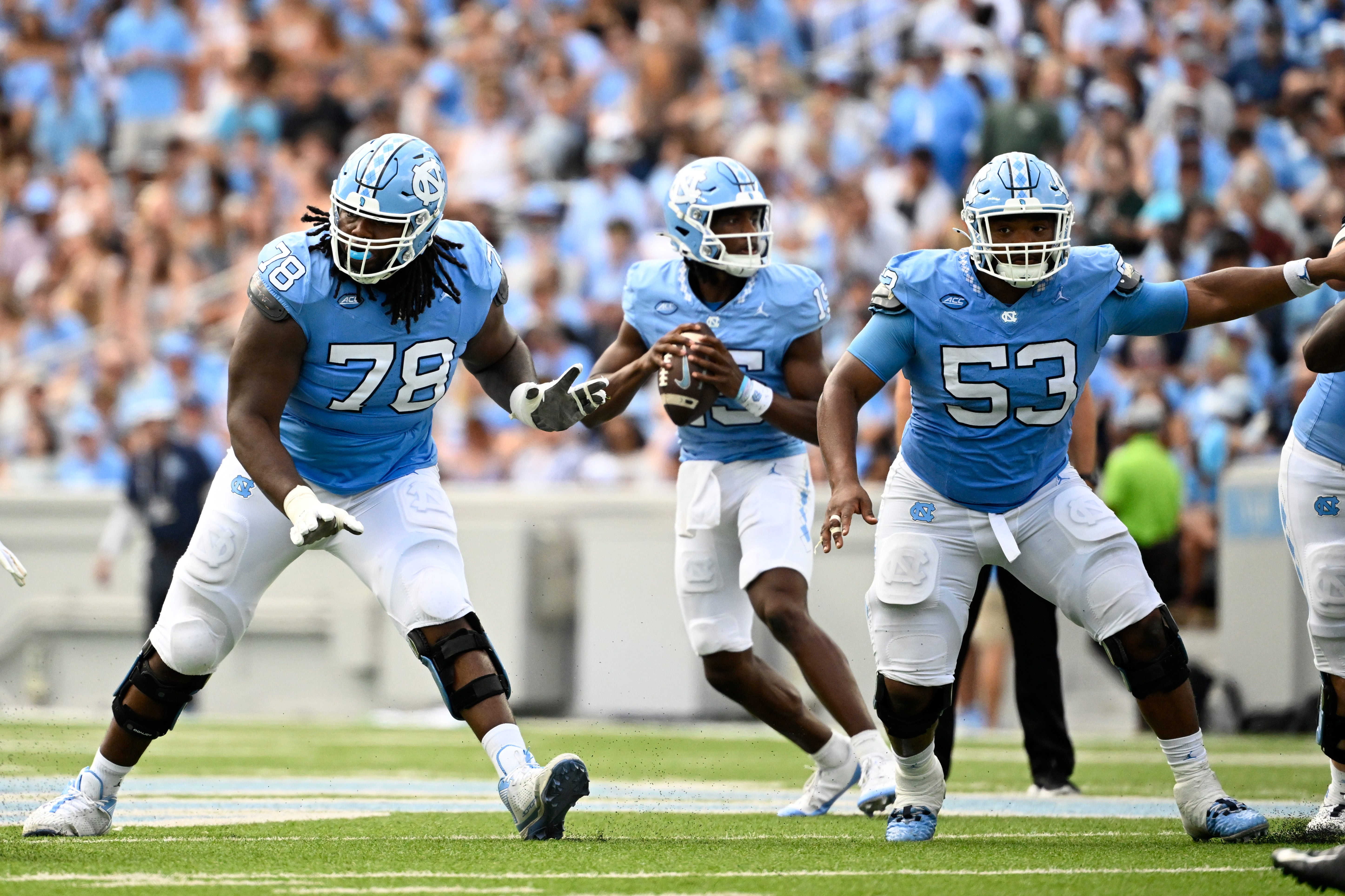 Sep 7, 2024; Chapel Hill, North Carolina, USA; North Carolina Tar Heels quarterback Conner Harrell (15) looks to pass as offensive linemen Trevyon Green (78) and Willie Lampkin (53) block in the second quarter at Kenan Memorial Stadium.