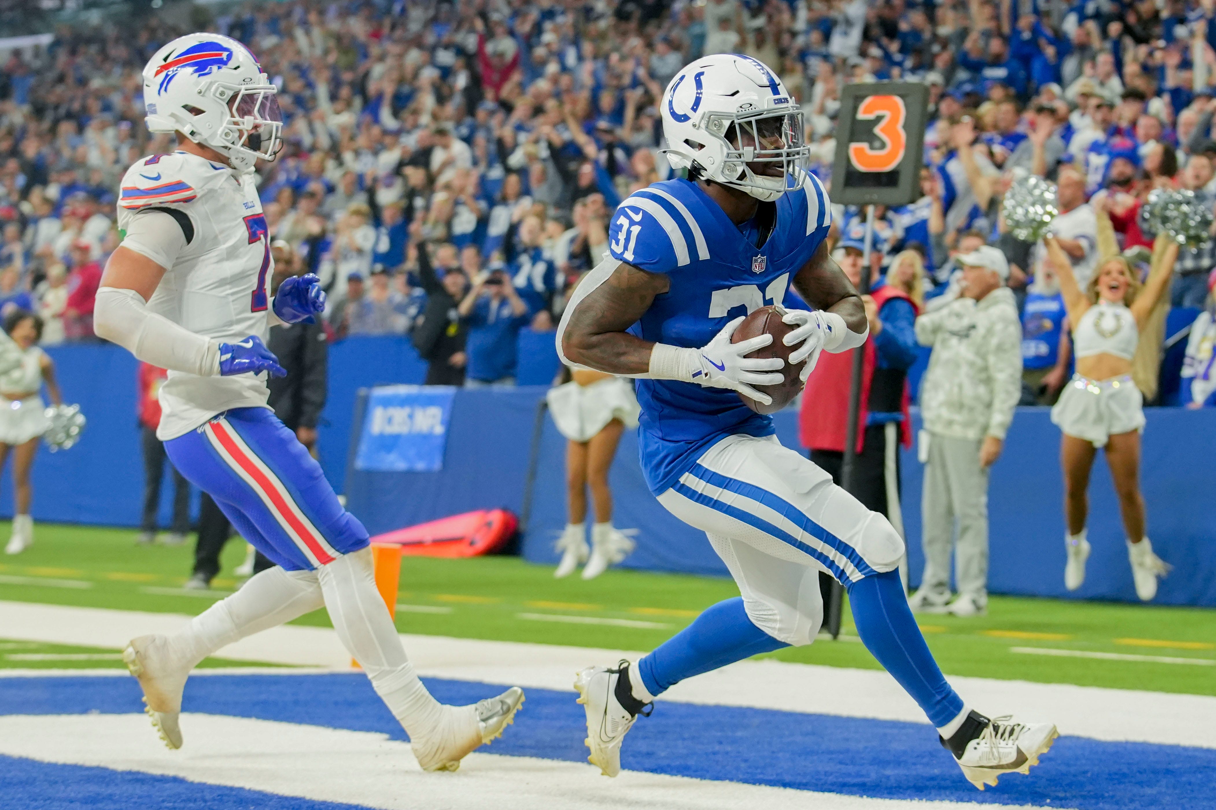 Buffalo Bills cornerback Taron Johnson (7) chases Indianapolis Colts running back Tyler Goodson (31) into the end zone as he makes a touchdown catch Sunday, Nov. 10, 2024, during a game against the Buffalo Bills at Lucas Oil Stadium in Indianapolis.