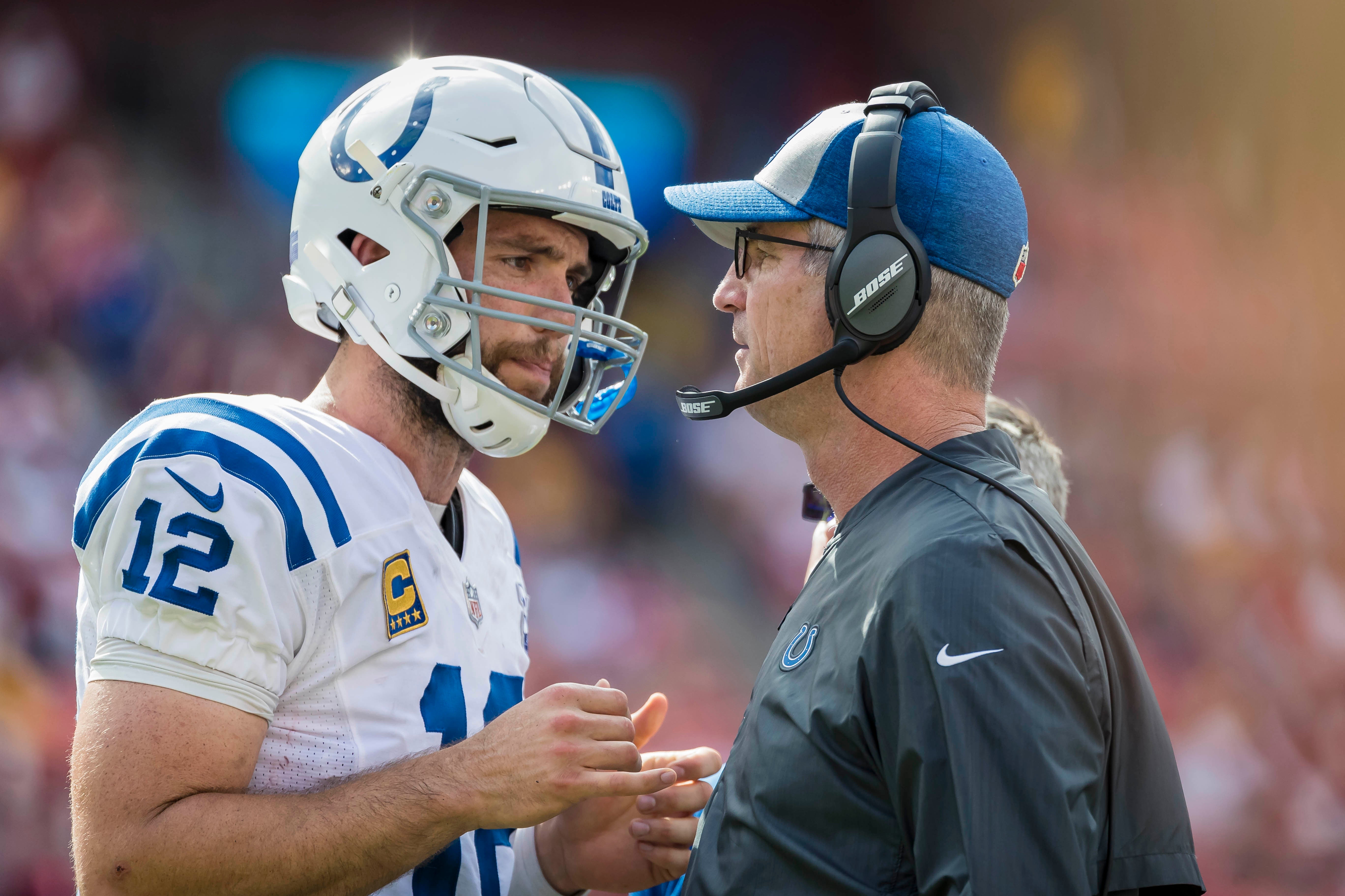 Sep 16, 2018; Landover, MD, USA; Indianapolis Colts quarterback Andrew Luck (12) speaks with head coach Frank Reich during the second half at FedEx Field.
