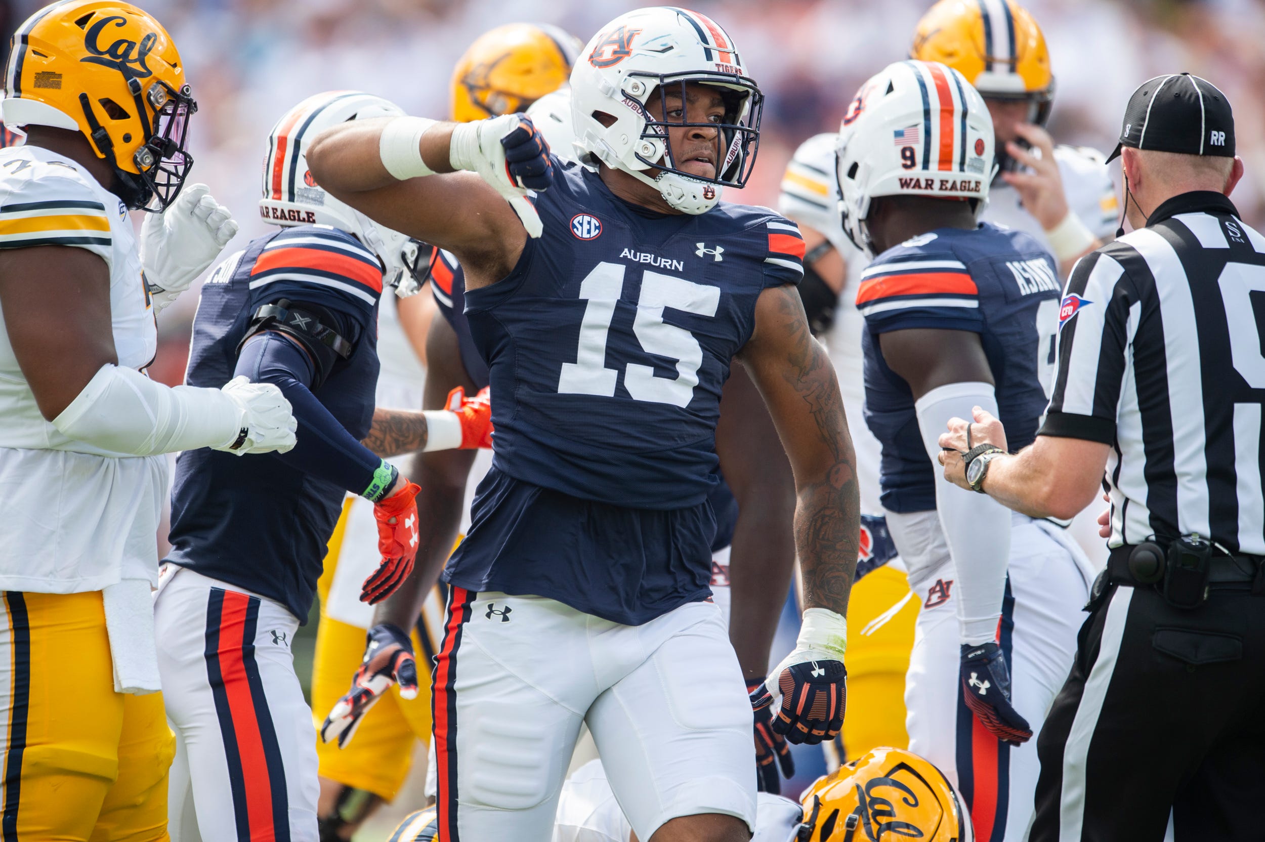 Keldric Faulk, EDGE Auburn celebrates a defensive play against California