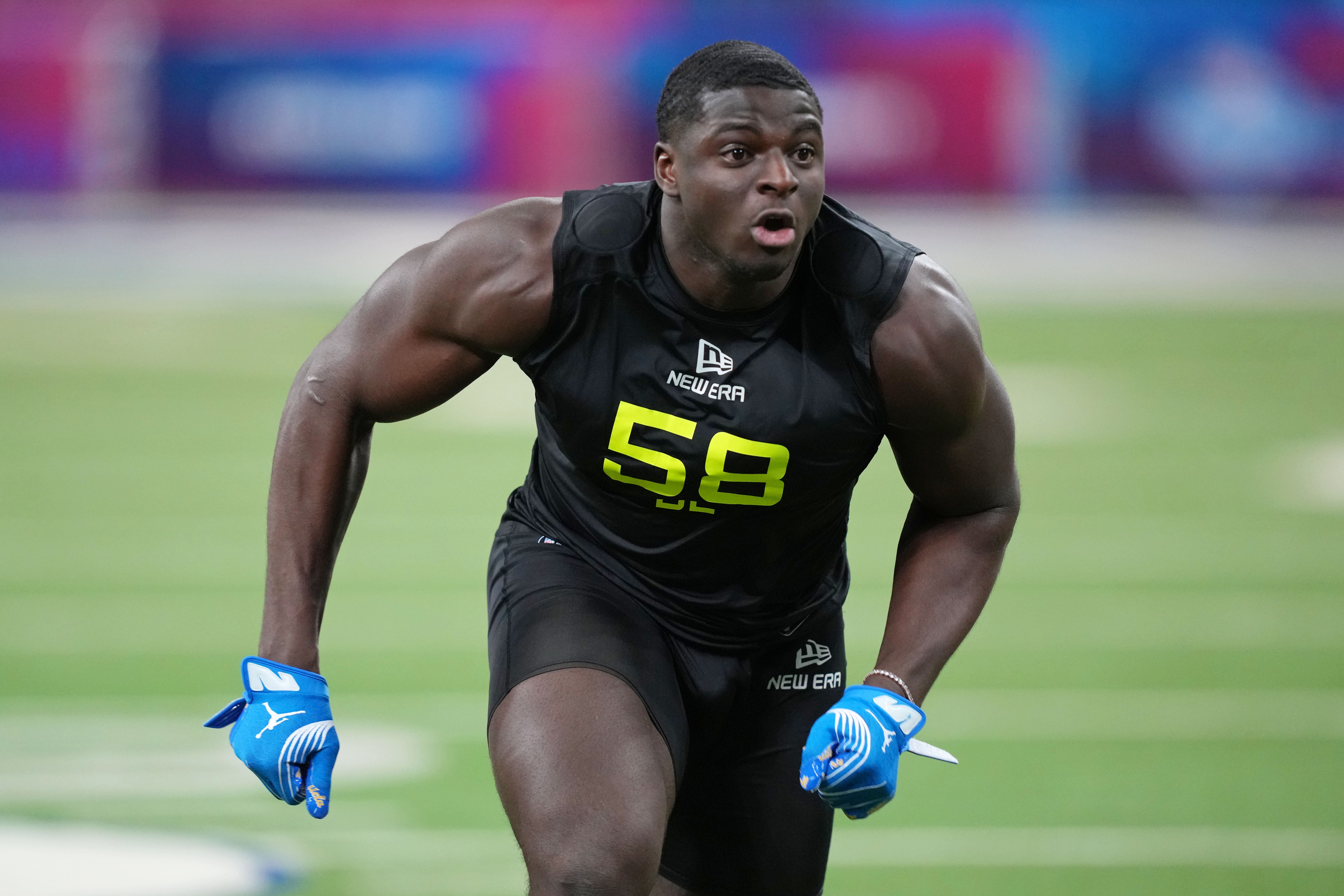 Feb 27, 2025; Indianapolis, IN, USA; UCLA defensive lineman Oluwafemi Oladejo (DL58) participates in drills during the 2025 NFL Combine at Lucas Oil Stadium.