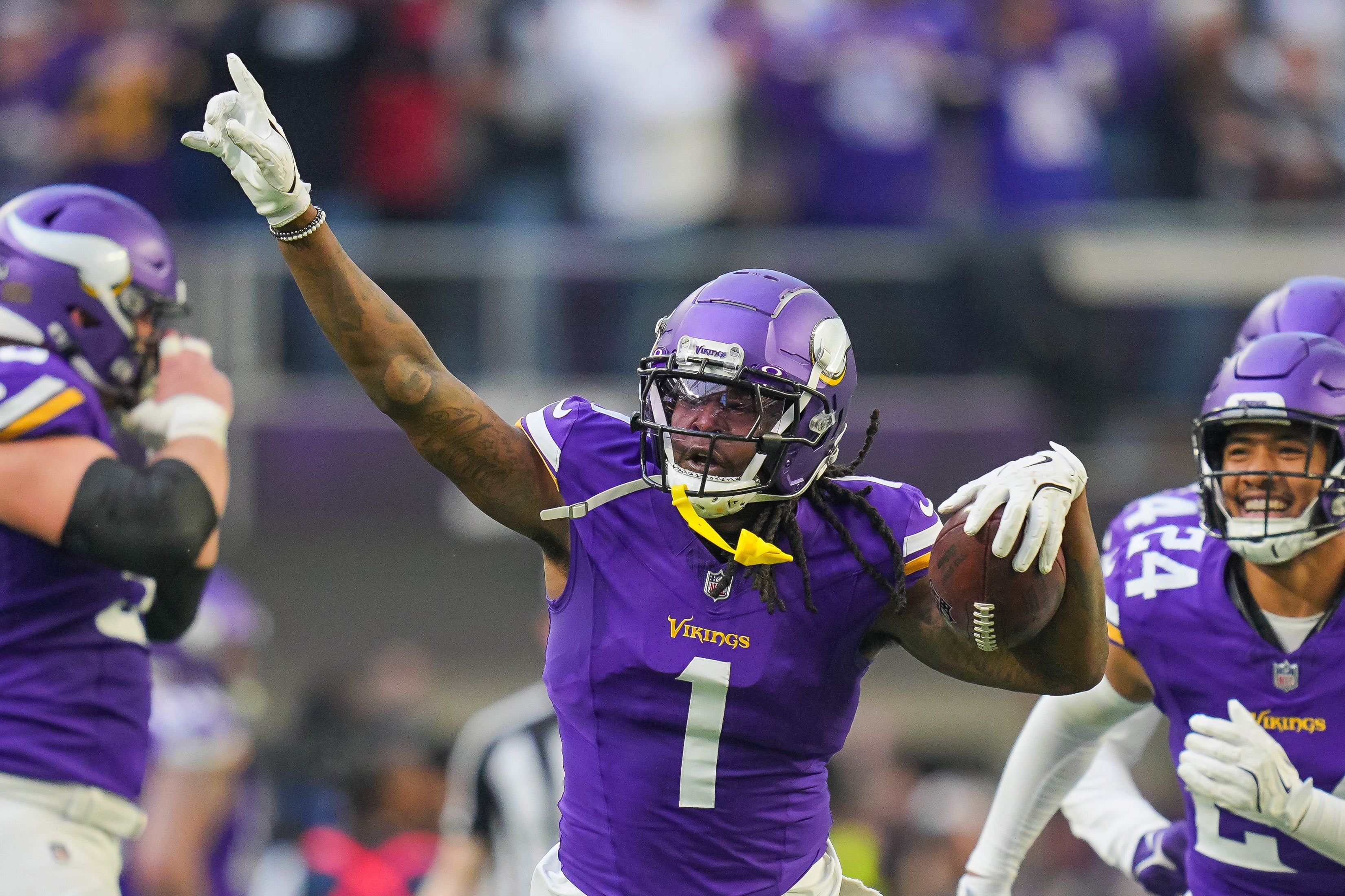 Dec 1, 2024; Minneapolis, Minnesota, USA; Minnesota Vikings cornerback Shaquill Griffin (1) celebrates his interception against the Arizona Cardinals in the fourth quarter at U.S. Bank Stadium.