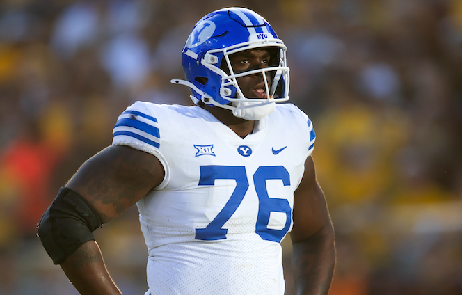Nov 23, 2024; Tempe, Arizona, USA; Brigham Young Cougars offensive lineman Caleb Etienne (76) against the Arizona State Sun Devils at Mountain America Stadium.