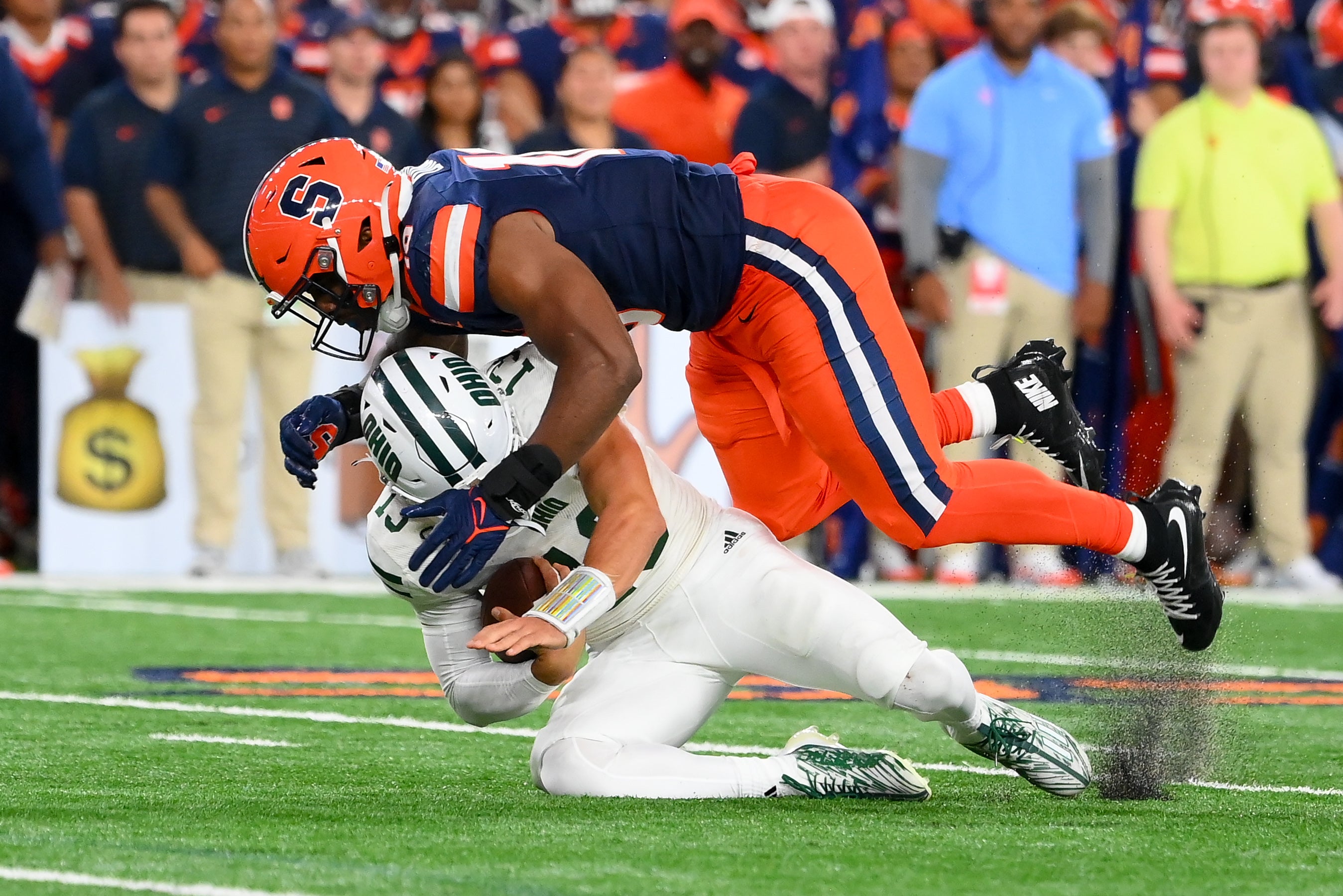 Syracuse Orange defensive lineman Fadil Diggs (10) sacks Ohio Bobcats quarterback Parker Navarro (13) during the second half at the JMA Wireless Dome.