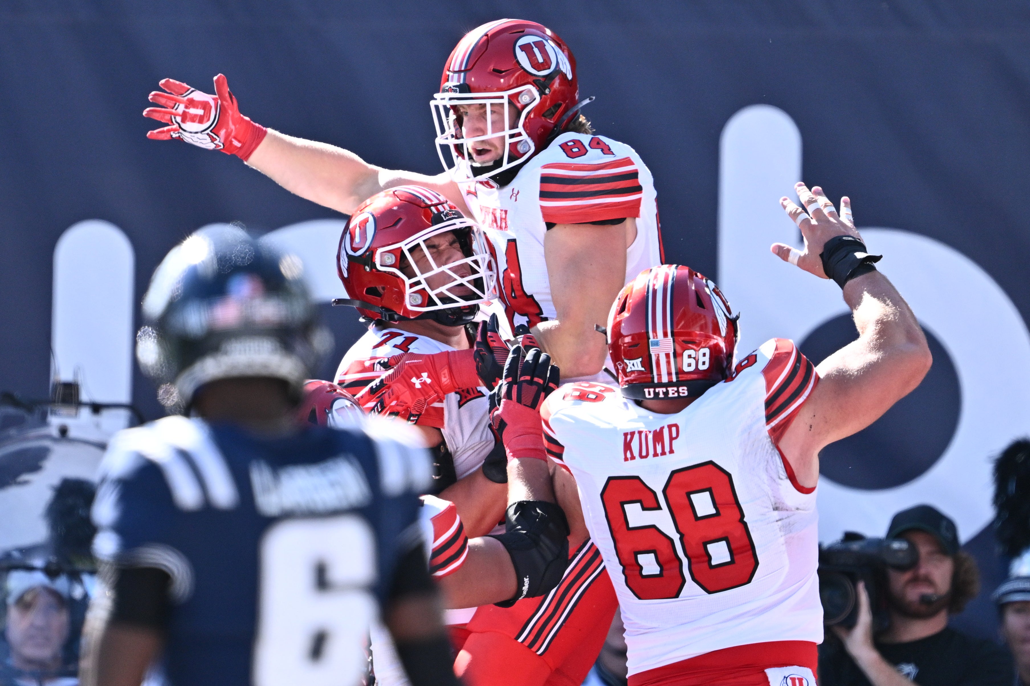 Sep 14, 2024; Logan, Utah, USA; Utah Utes tight end Caleb Lohner (84) celebrates after catching a touchdown pass in the first half against the Utah State Aggies at Merlin Olsen Field at Maverik Stadium.