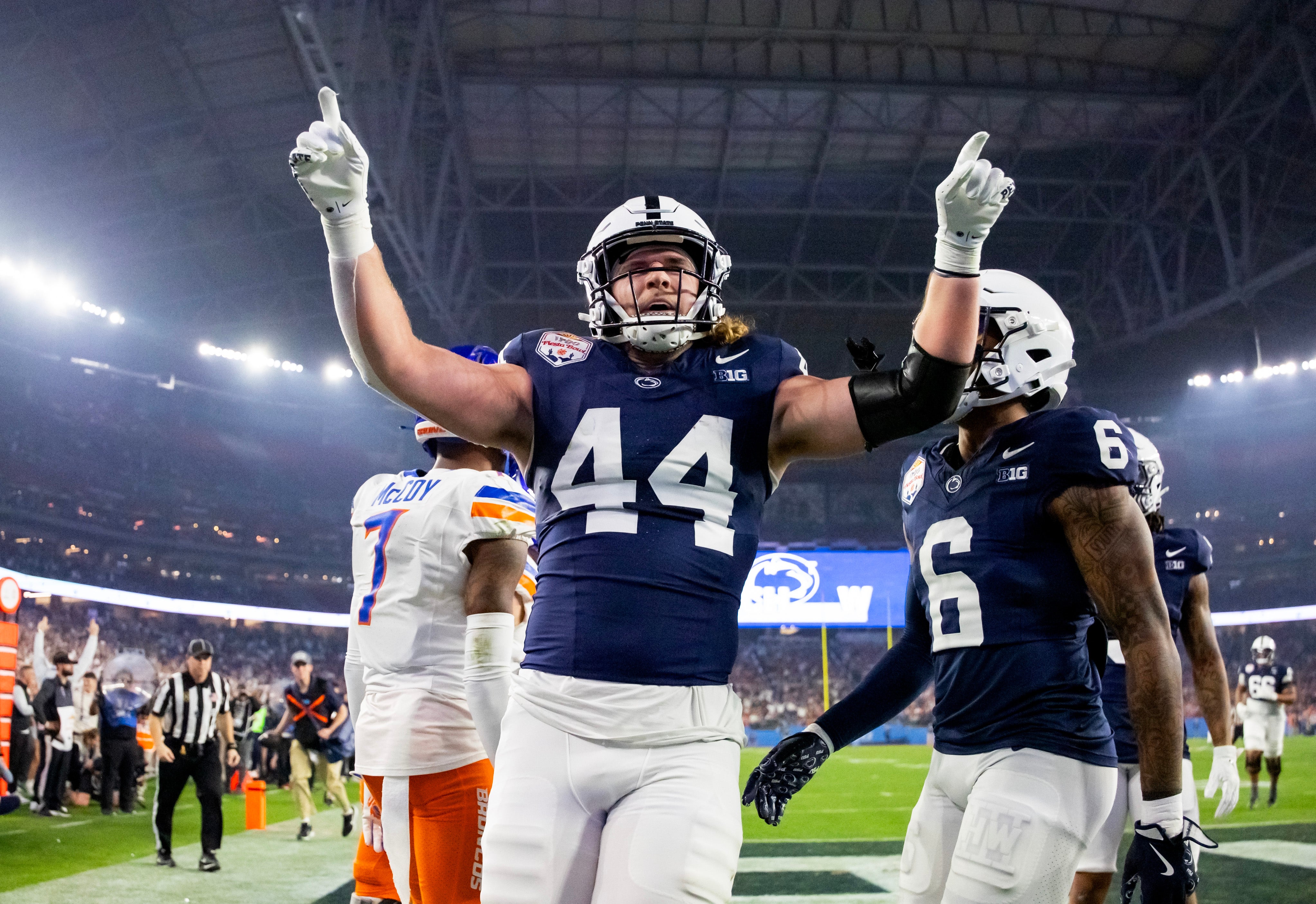 Dec 31, 2024; Glendale, AZ, USA; Penn State Nittany Lions tight end Tyler Warren (44) celebrates after scoring a touchdown against the Boise State Broncos in the Fiesta Bowl at State Farm Stadium.