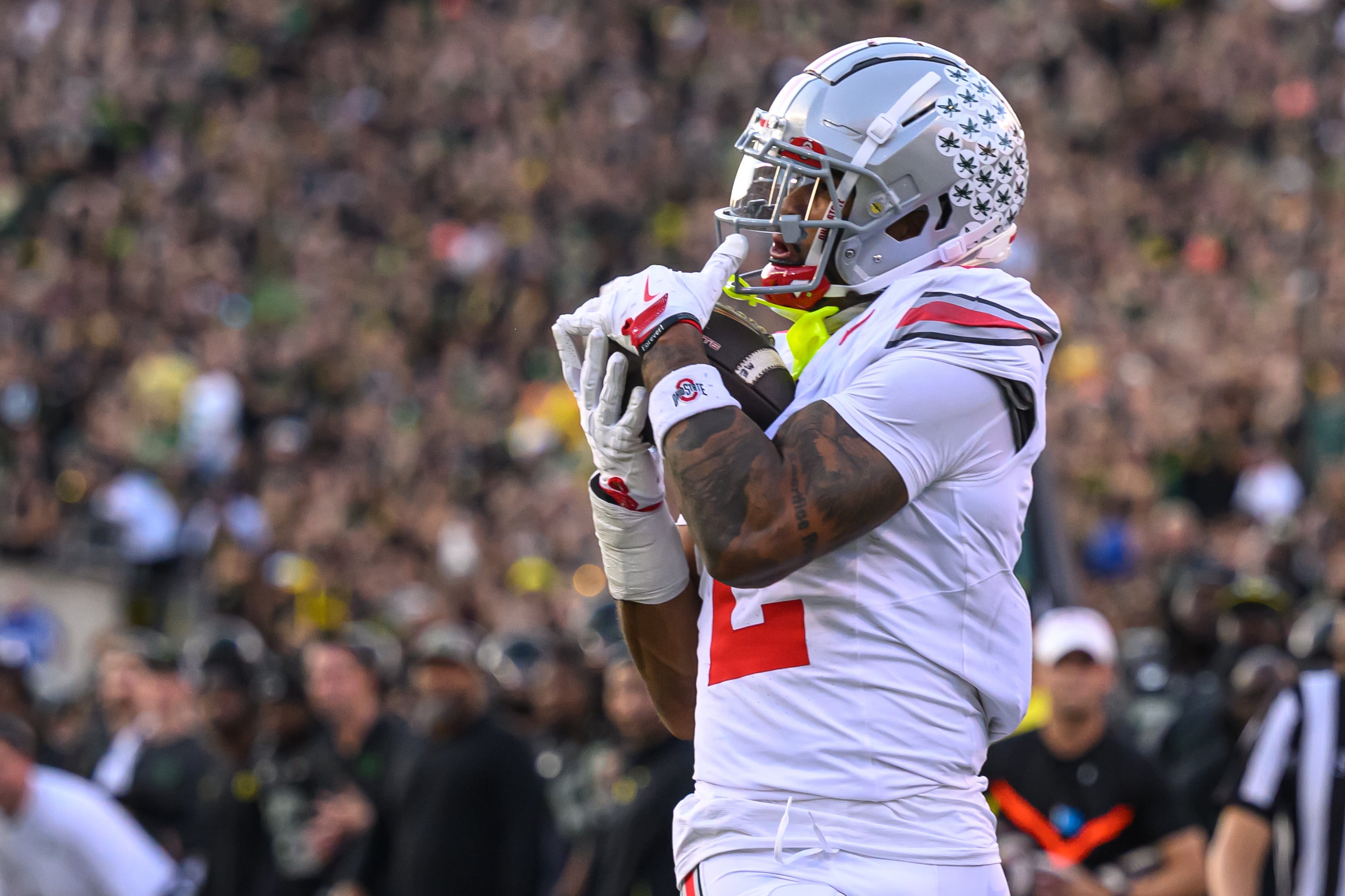 Ohio State Buckeyes wide receiver Emeka Egbuka (2) catches a pass for a touchdown during the second quarter against the Oregon Ducks at Autzen Stadium. 
