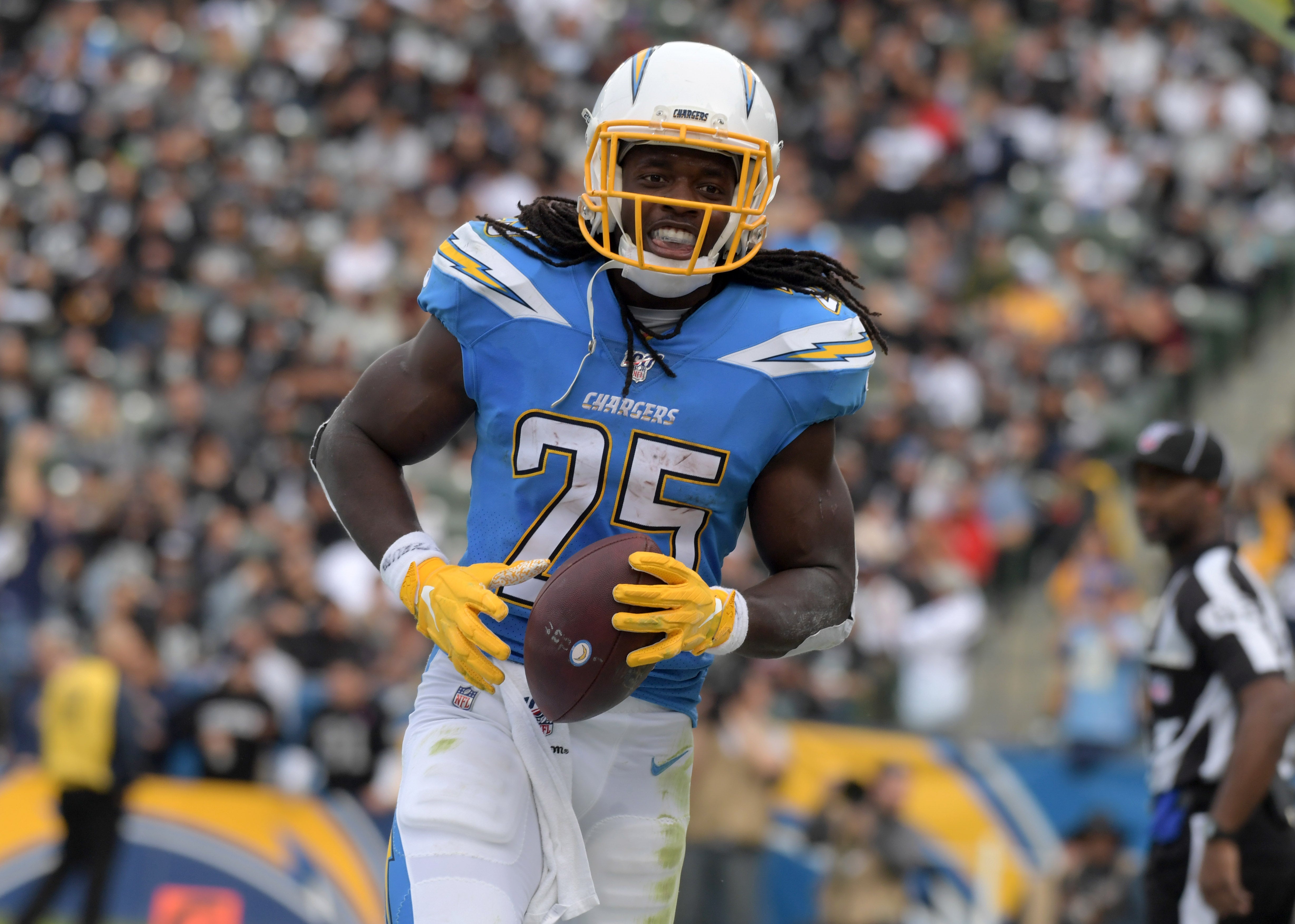 Dec 22, 2019; Carson, California, USA; Los Angeles Chargers running back Melvin Gordon (25) celebrates after scoring on a 1-yard touchdown run in the second quarter against the Oakland Raiders at Dignity Health Sports Park.