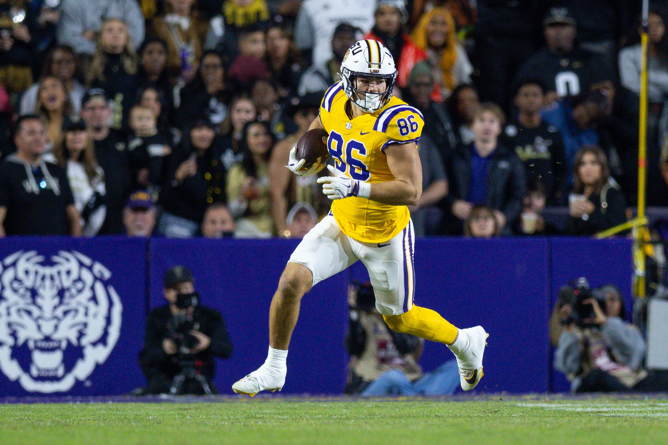 LLSU Tigers tight end Mason Taylor (86) runs after a catch against the Vanderbilt Commodores during the first half at Tiger Stadium.