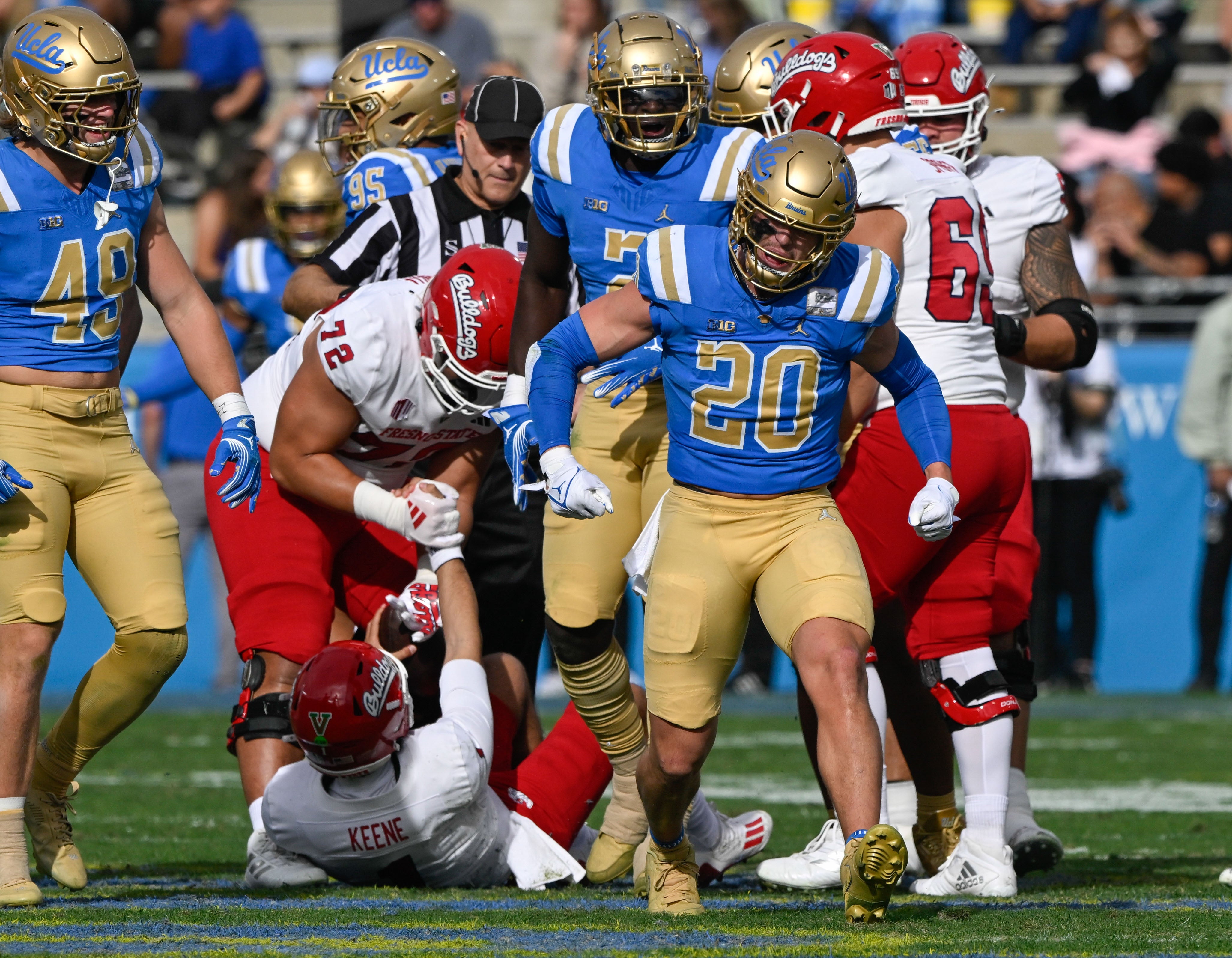 Nov 30, 2024; Pasadena, California, USA; UCLA Bruins linebacker Kain Medrano (20) celebrates sacking Fresno State Bulldogs quarterback Mikey Keene (1) during the section quarter at Rose Bowl.