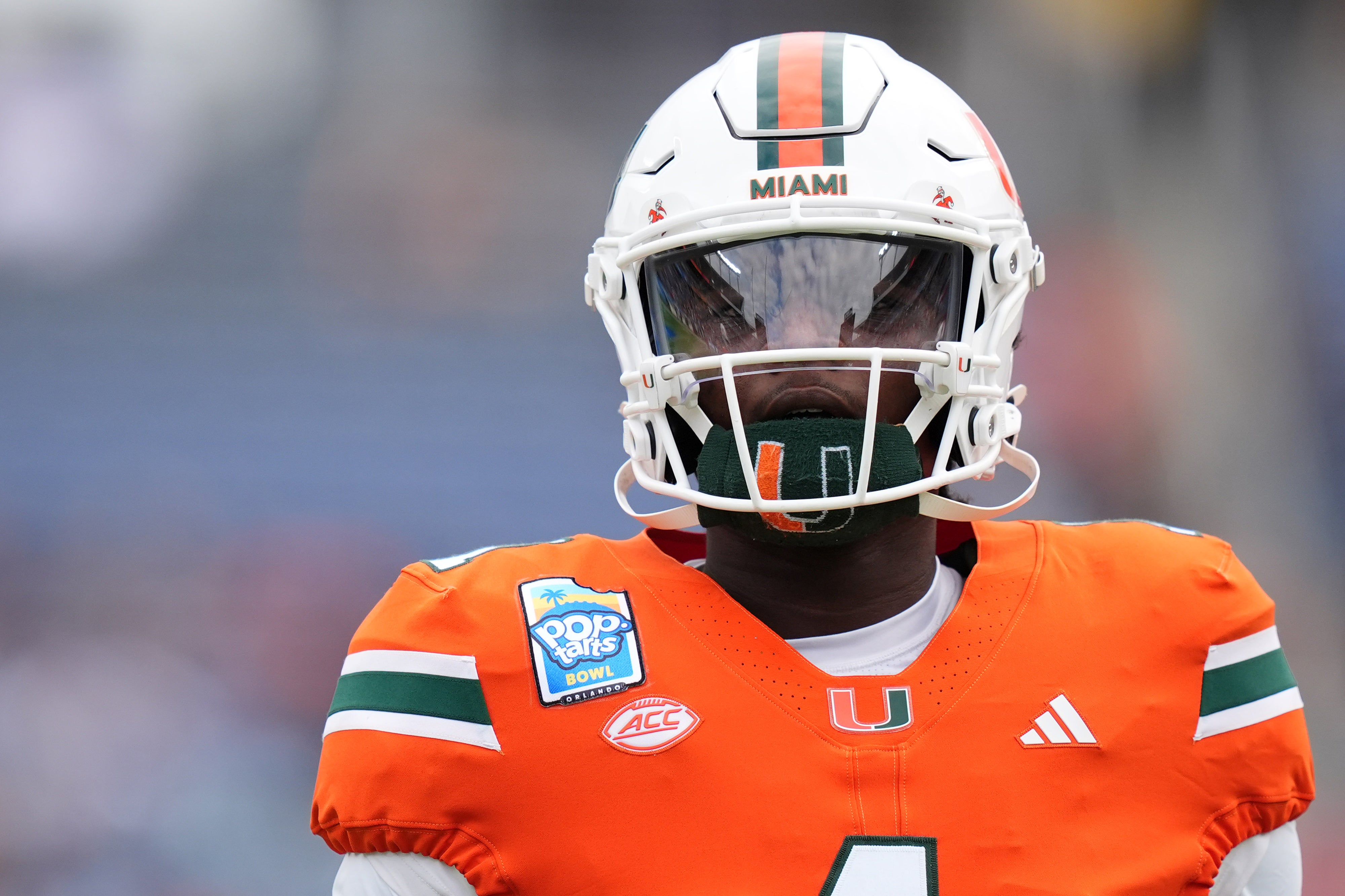Dec 28, 2024; Orlando, FL, USA; Miami Hurricanes quarterback Cam Ward (1) warms up prior to the game against the Iowa State Cyclones at Camping World Stadium.