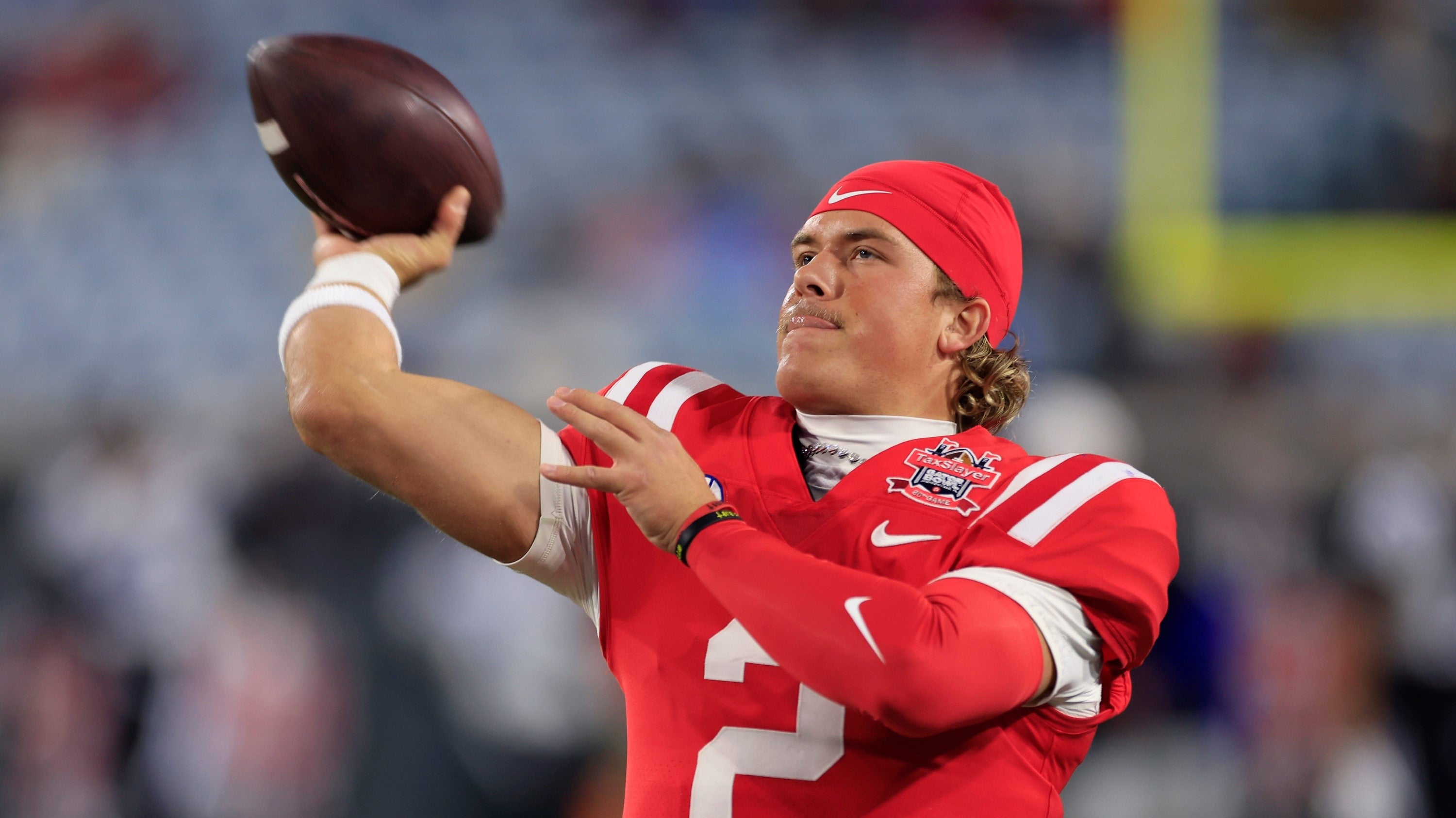 Mississippi Rebels quarterback Jaxson Dart (2) warms up before the TaxSlayer Gator Bowl Thursday, Jan. 2, 2025 at EverBank Stadium in Jacksonville, Fla.