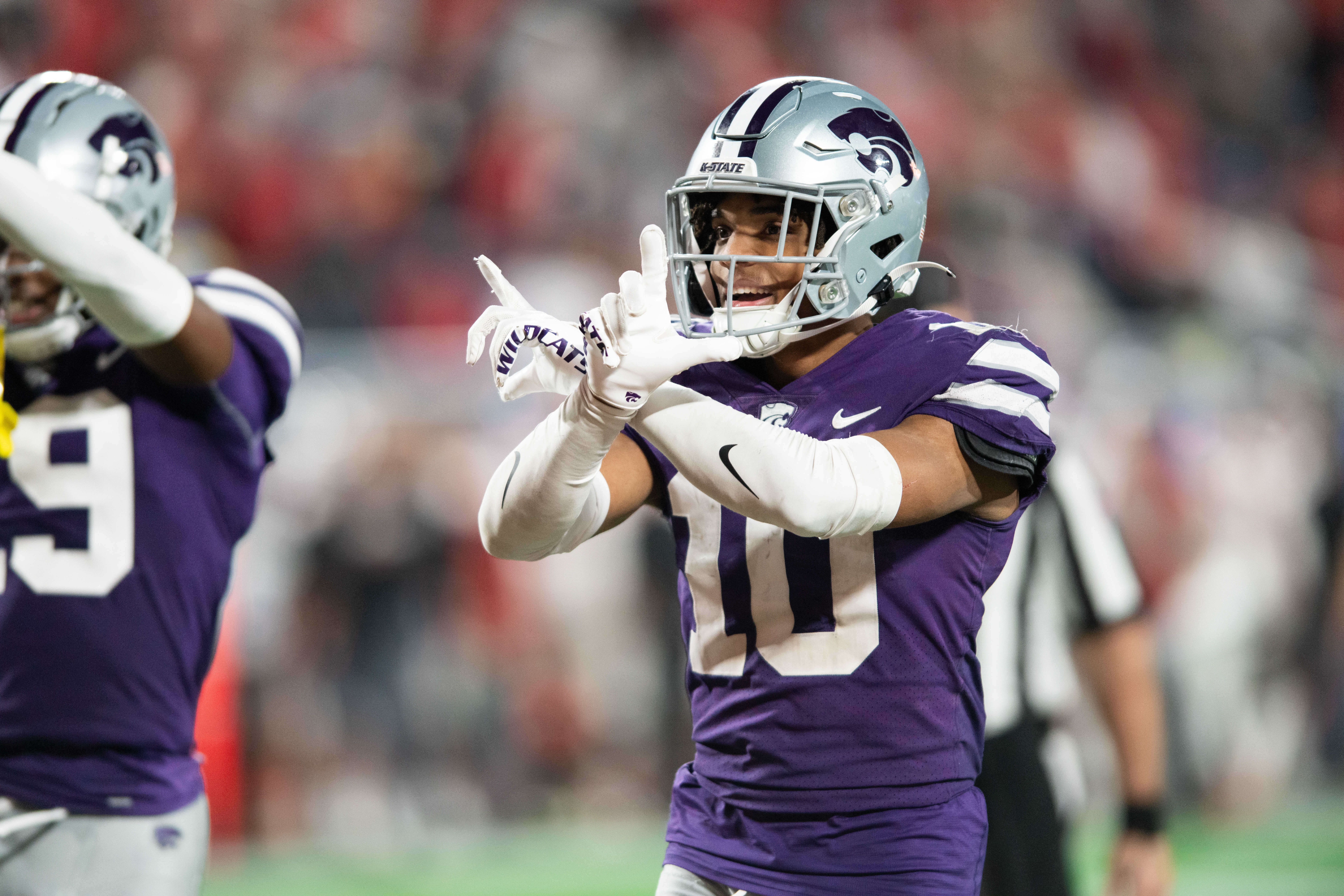 Dec 28, 2023; Orlando, FL, USA; Kansas State cornerback Jacob Parrish (10) celebrates an interception against NC State in the fourth quarter at Camping World Stadium.